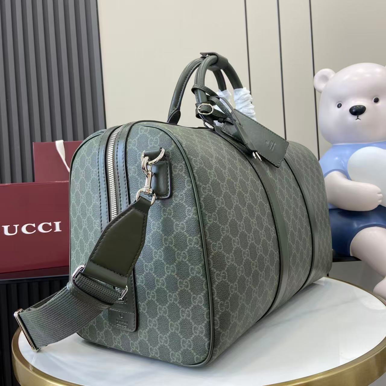 Gucci Medium Duffle Bag in Green Gucci Letter Pattern Coated Fabric 2 i1757139440655 7786 0 1