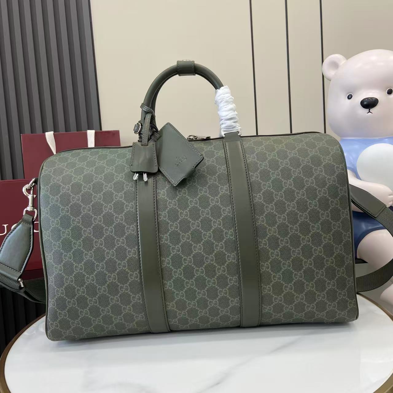 Gucci Medium Duffle Bag in Green Gucci Letter Pattern Coated Fabric 1 i1757139479325 7238 0 0