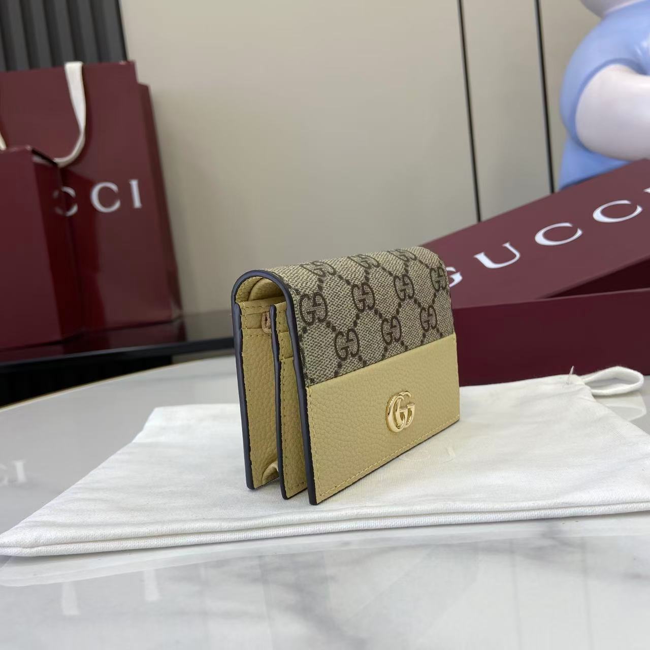 Портмоне Gucci с монограммой и логотипом GG