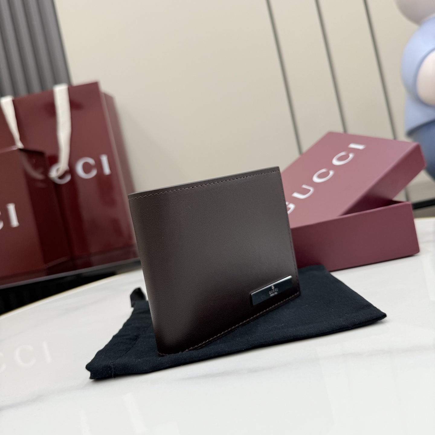 gucci dark brown leather bifold metal tag wallet