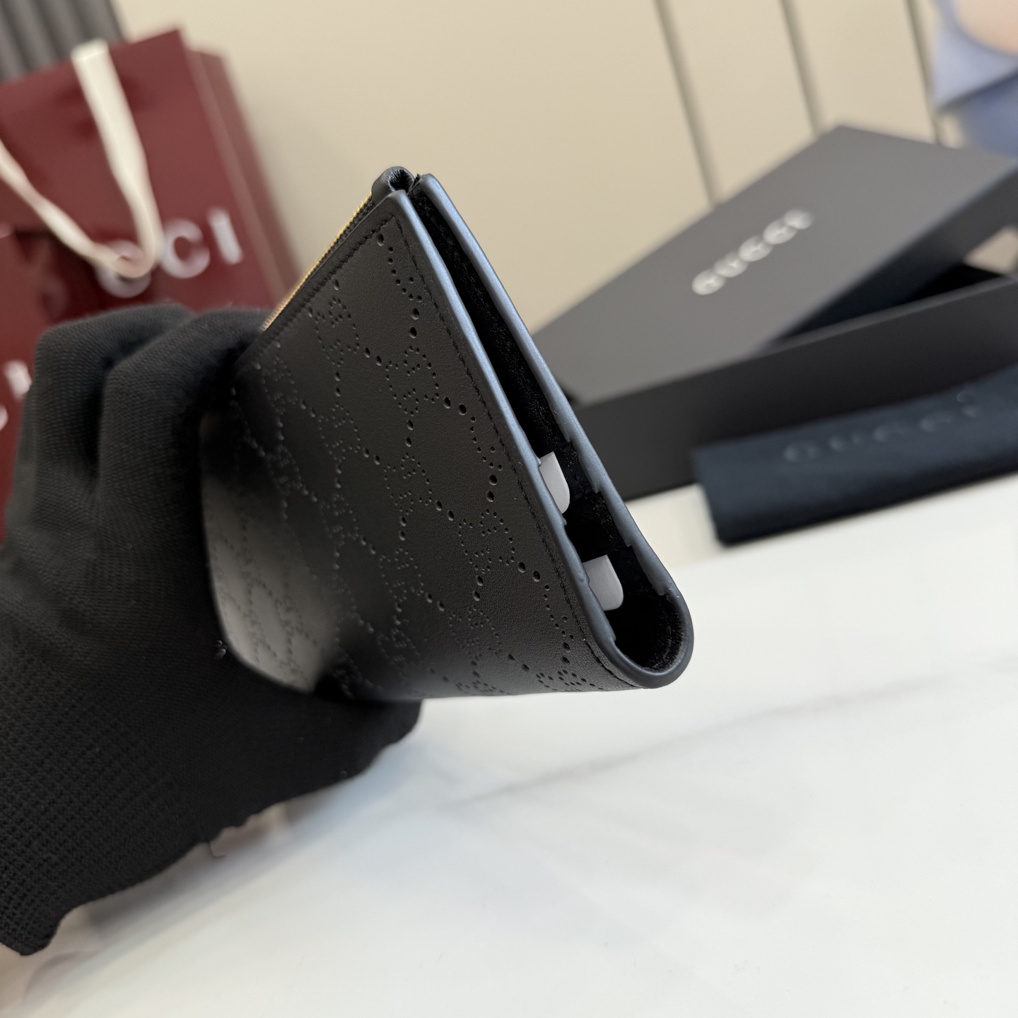 gucci black perforated gg leather long wallet