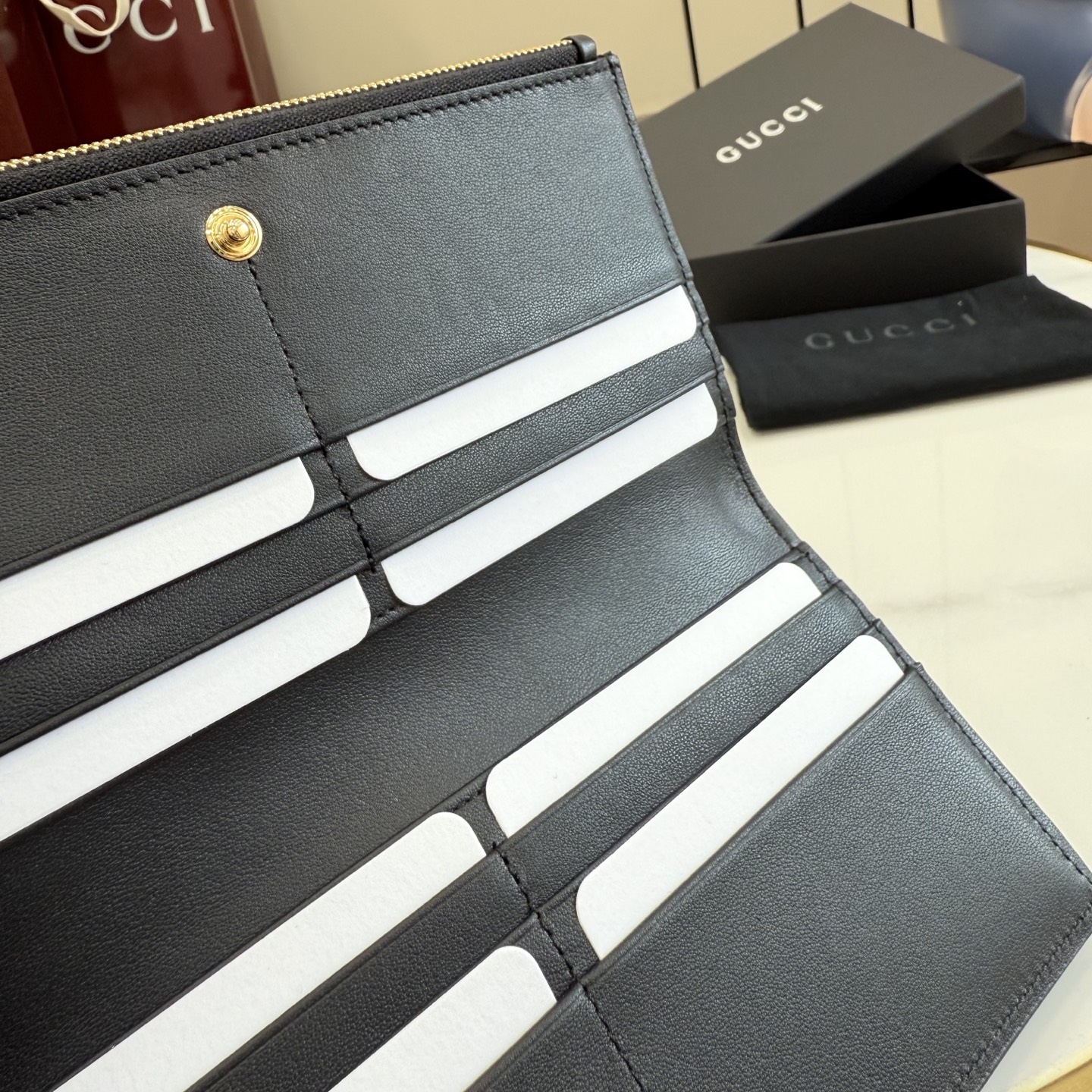gucci black perforated gg leather long wallet