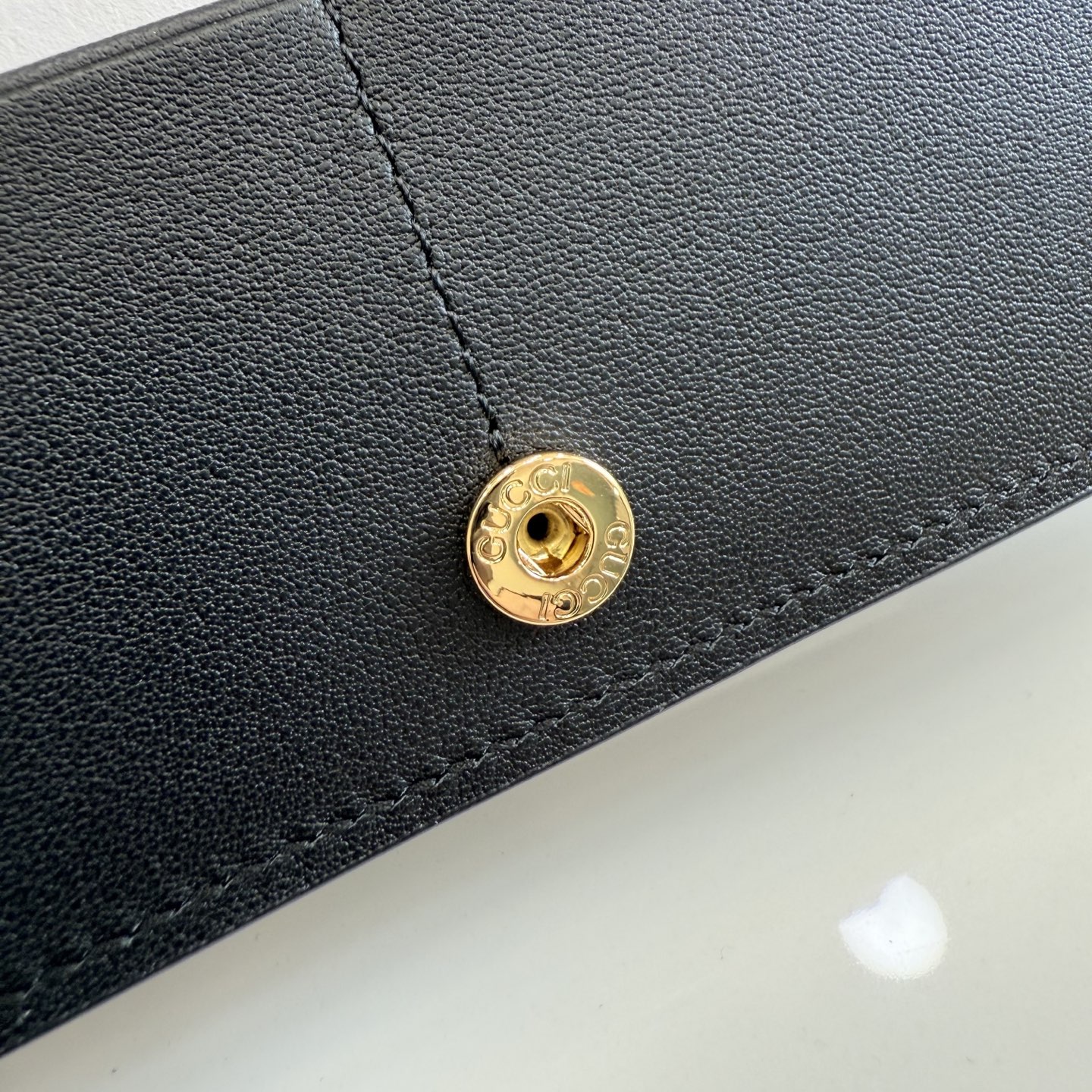 gucci black perforated gg leather long wallet