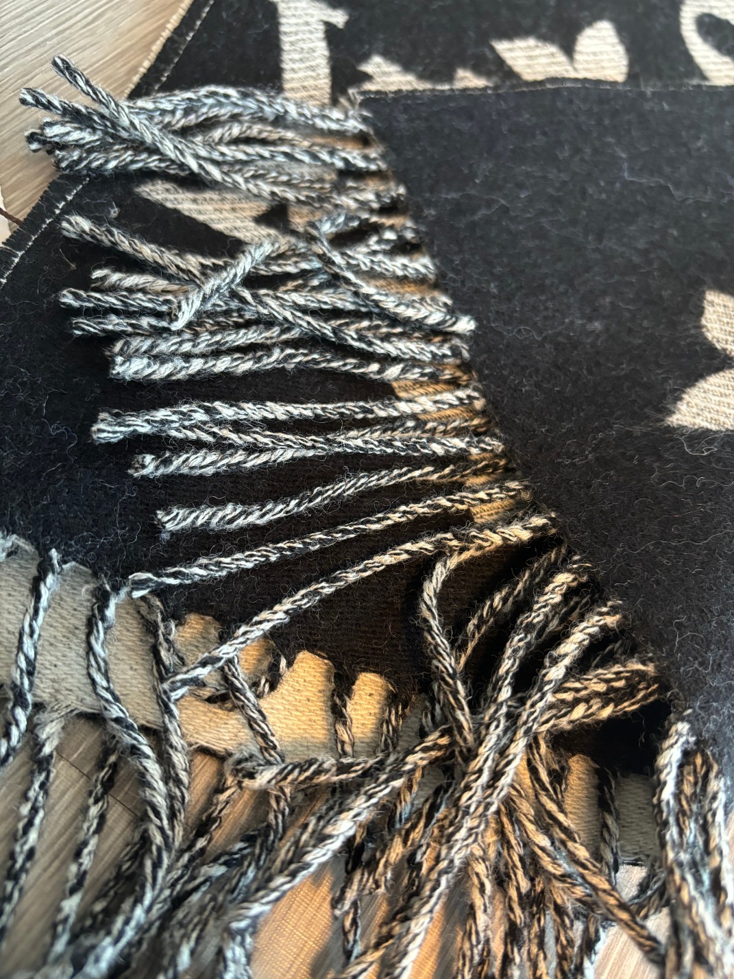 Finished with slender fringe along both ends, this scarf combines a - Scarf 2