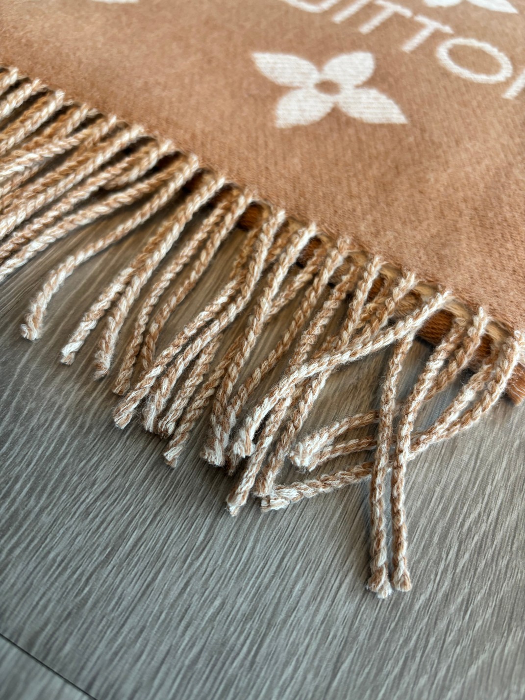 Finished with slender fringe along both ends, this scarf combines a - Scarf 3
