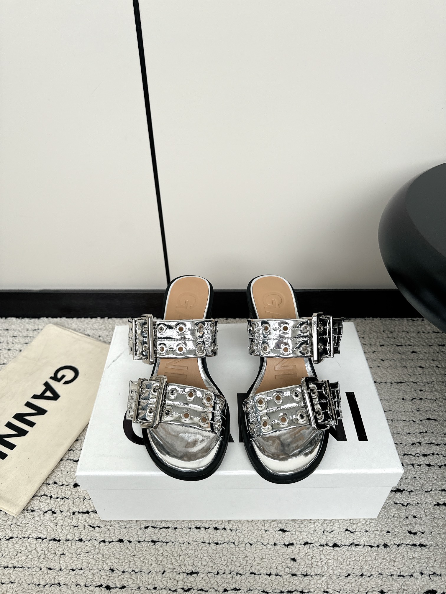 Ganni Summer Collection: Round Head, Belt Buckle, Slippers – Punk and Ballet Fusion.