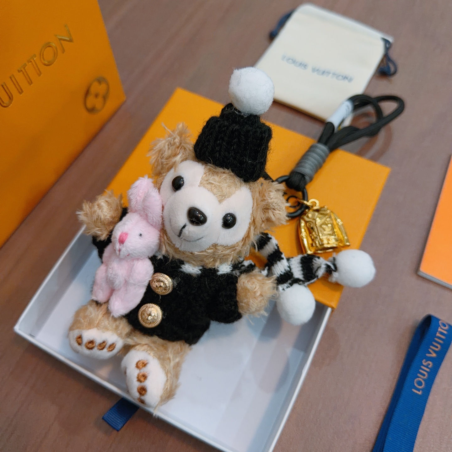 Louis Vuitton Anger Forest pendant Gold-tone metal black cord beige plush pink plush black knit white pom-pom accents 12cm