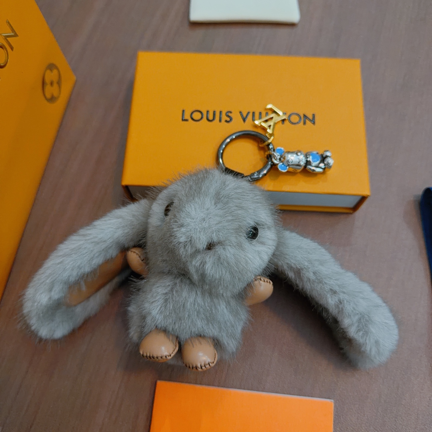 Louis Vuitton Anger Forest Bunny Keychain pendant gray mink fur tan leather silver-tone metal blue enamel gold-tone LV logo 12cm total length