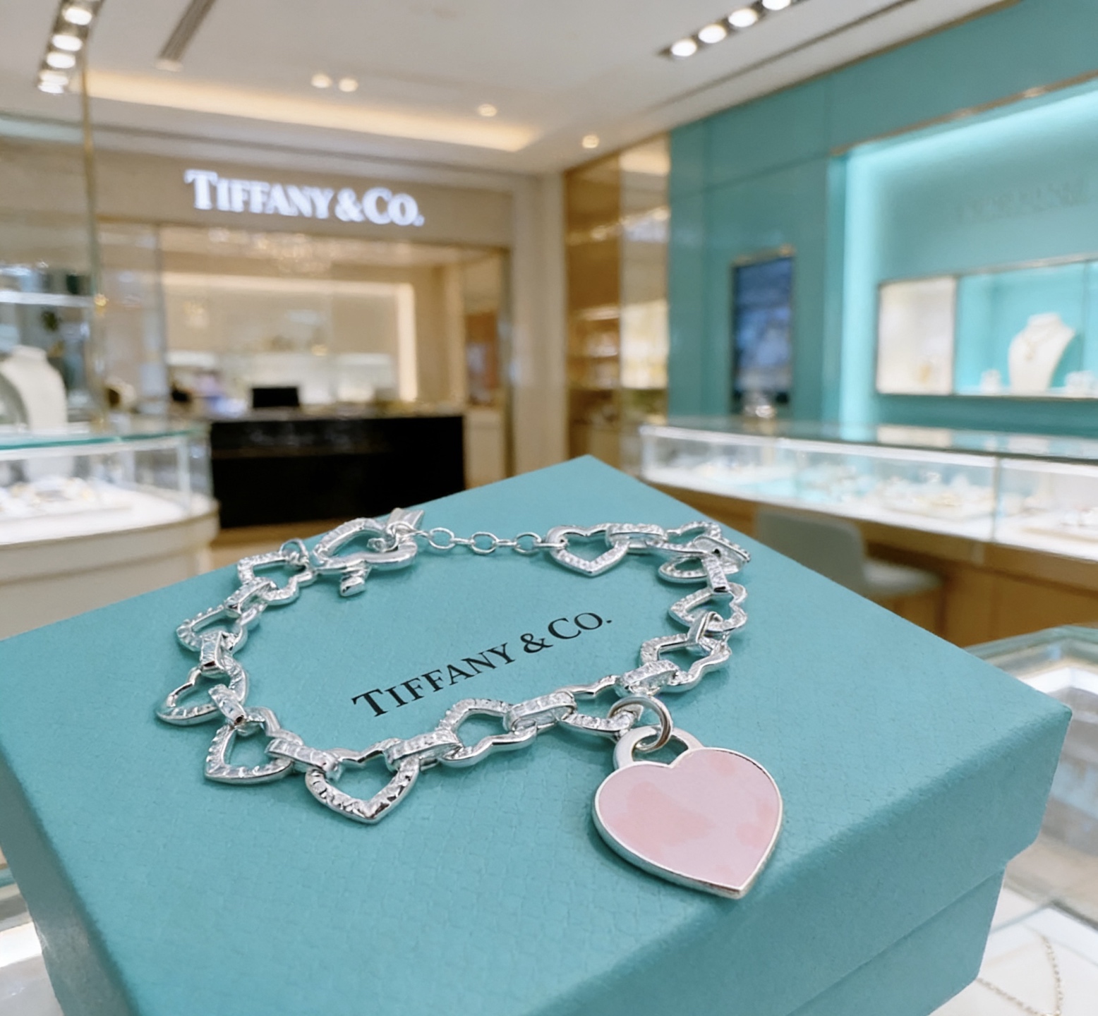 Tiffany Co Heart Link Toggle Bracelet with Pink Enamel Heart Tag bracelet silver-toned metal with clear pave accents and pink enamel heart charm 7 inches