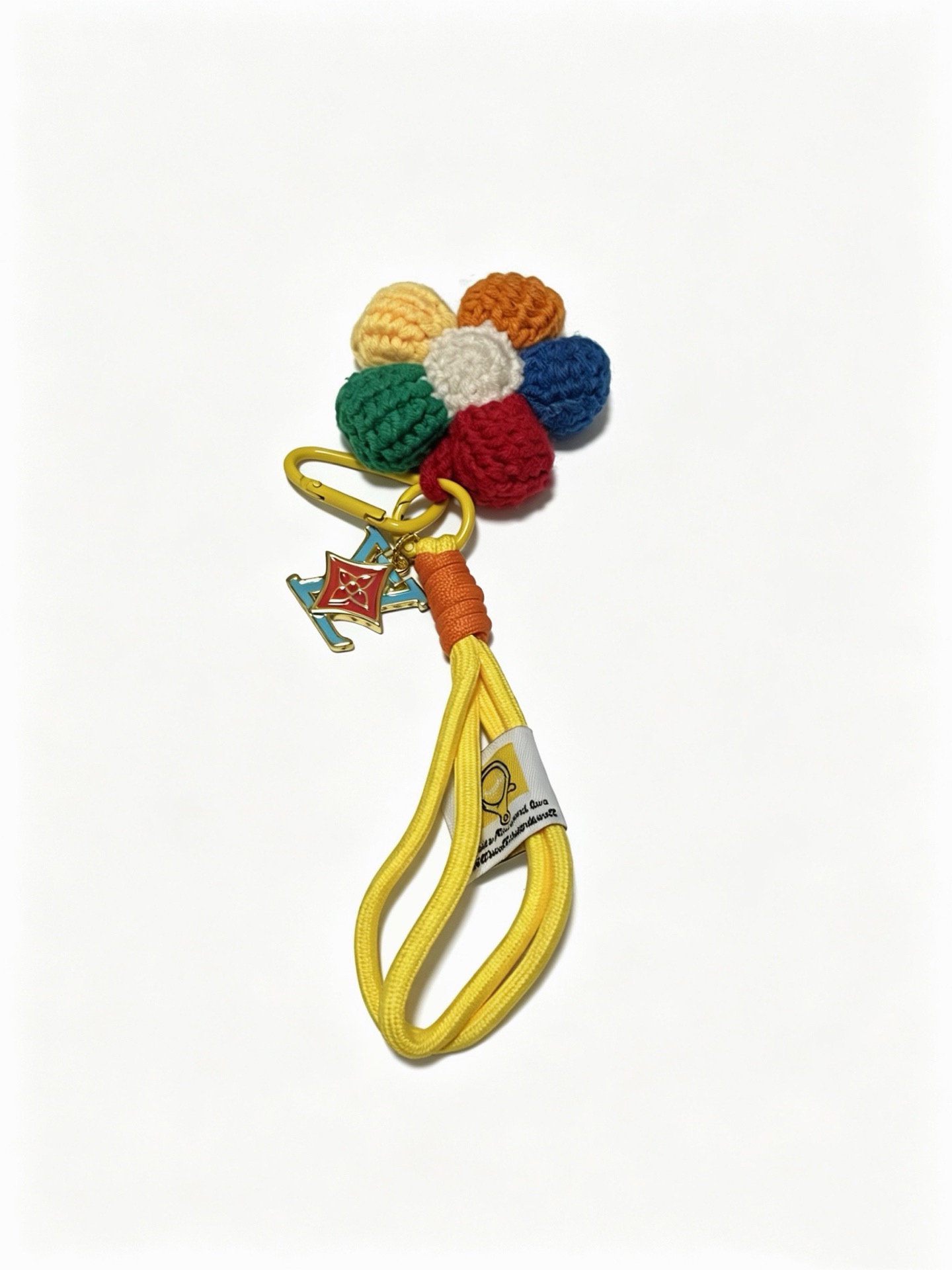 Louis Vuitton Anger Forest Crochet Flower Keychain Charm pendant Gold-tone metal with red and light blue enamel multicolor crocheted yarn navy red orange cream pale yellow green yellow nylon cord with orange cord wrap 18cm strap length