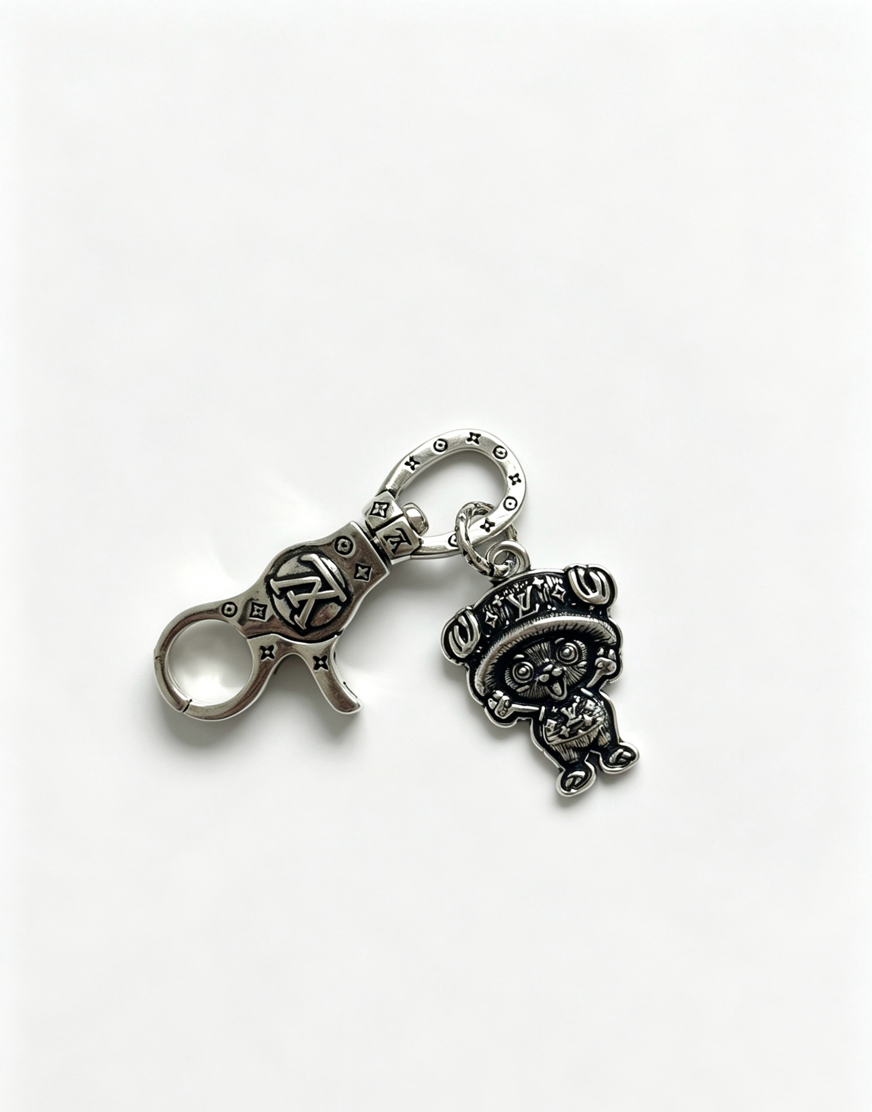 Louis Vuitton Anger Forest Chopper Charm Keychain pendant antique silver-toned metal with black oxidized detailing 8cm total length