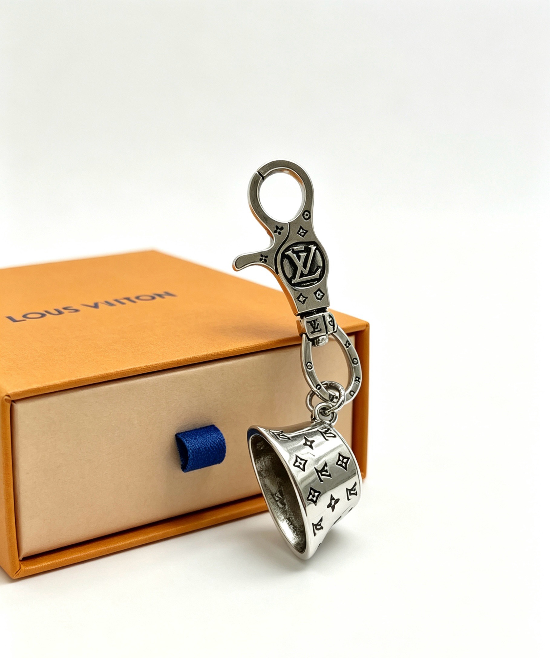 Louis Vuitton Anger Forest Bell Key Charm pendant silver-toned metal with black enamel monogram detailing 9cm total length