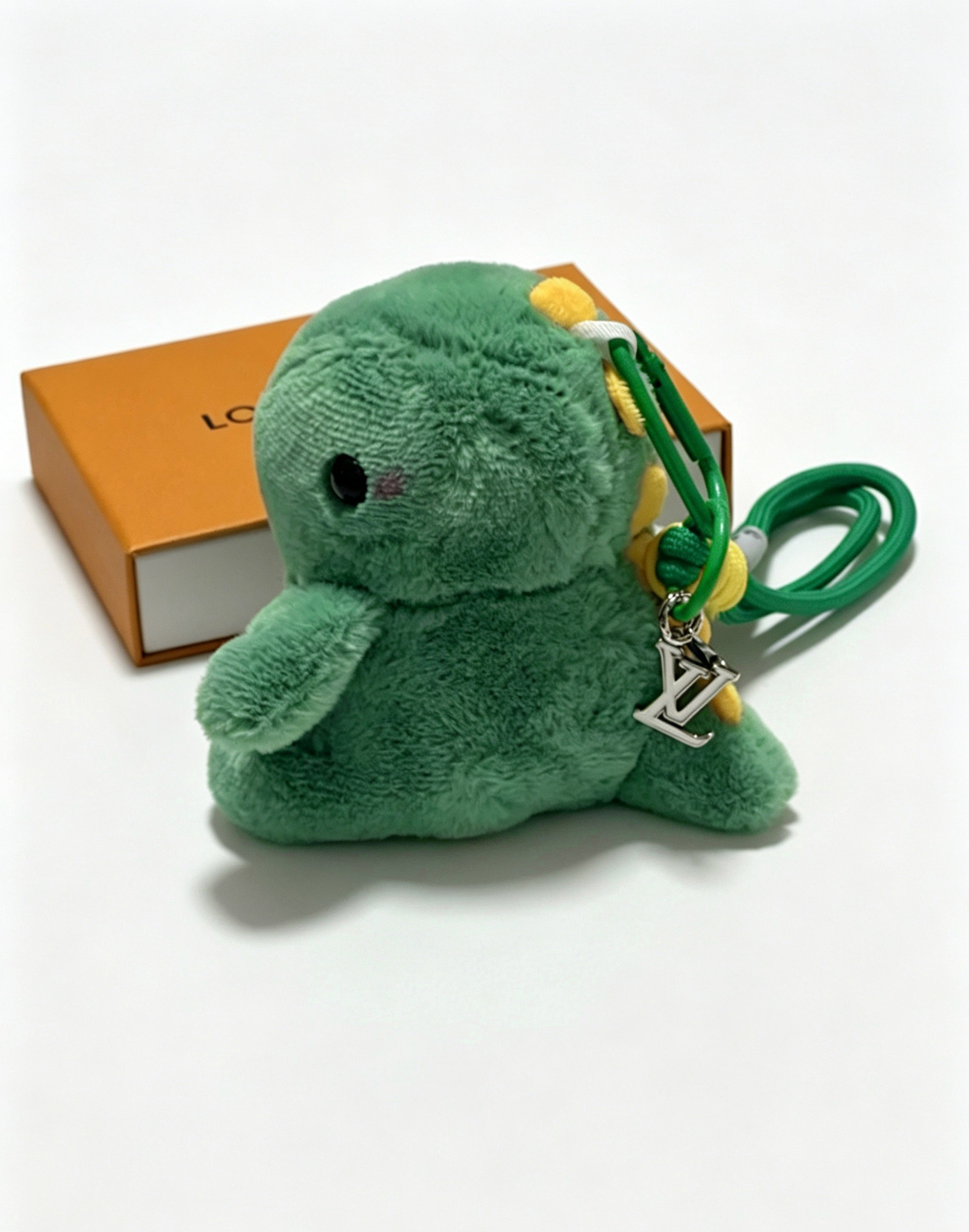 Louis Vuitton Anger Forest Plush Dinosaur Keychain pendant green plush yellow cord wrap silver-tone metal hardware green cord black eye detail 12cm total strap length