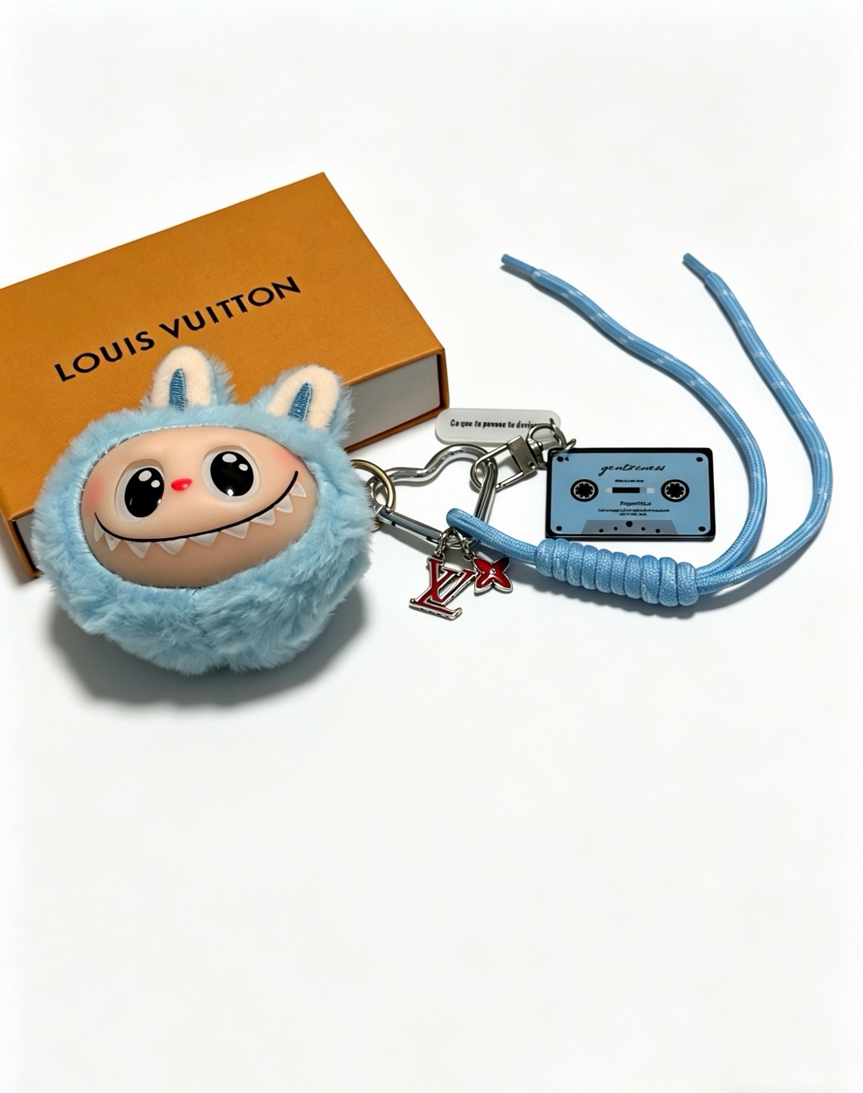 Louis Vuitton Anger Forest Labubu Cassette Charm Keychain pendant light blue plush silver-tone metal red enamel light blue cord black cassette detailing beige plush ear accents 20cm lanyard length