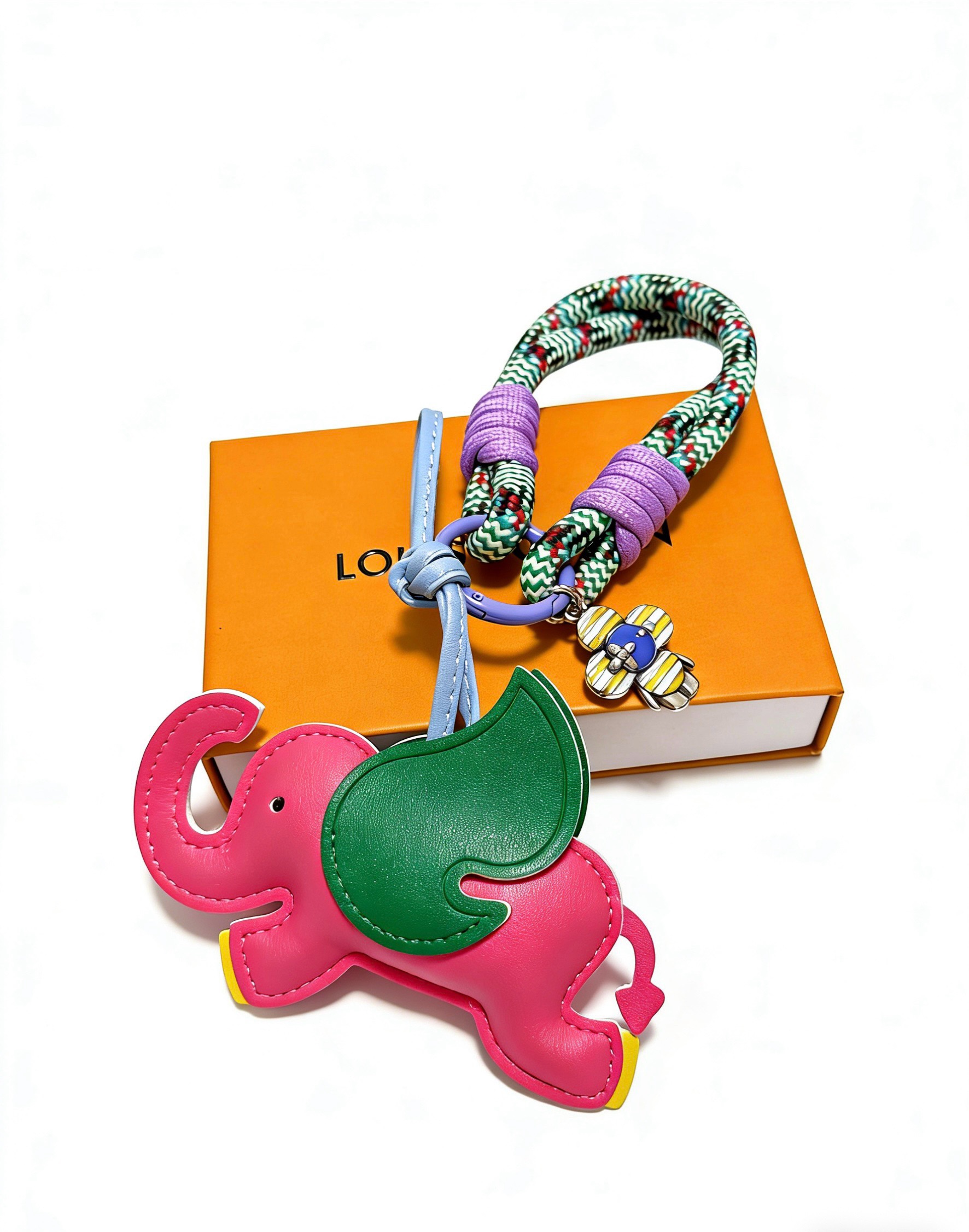 Louis Vuitton Anger Forest Elephant Keychain pendant Pink leather elephant with green ear yellow feet light blue leather strap purple cord wraps green-white chevron braided rope purple metal ring yellow-blue-silver enamel flower charm 12cm