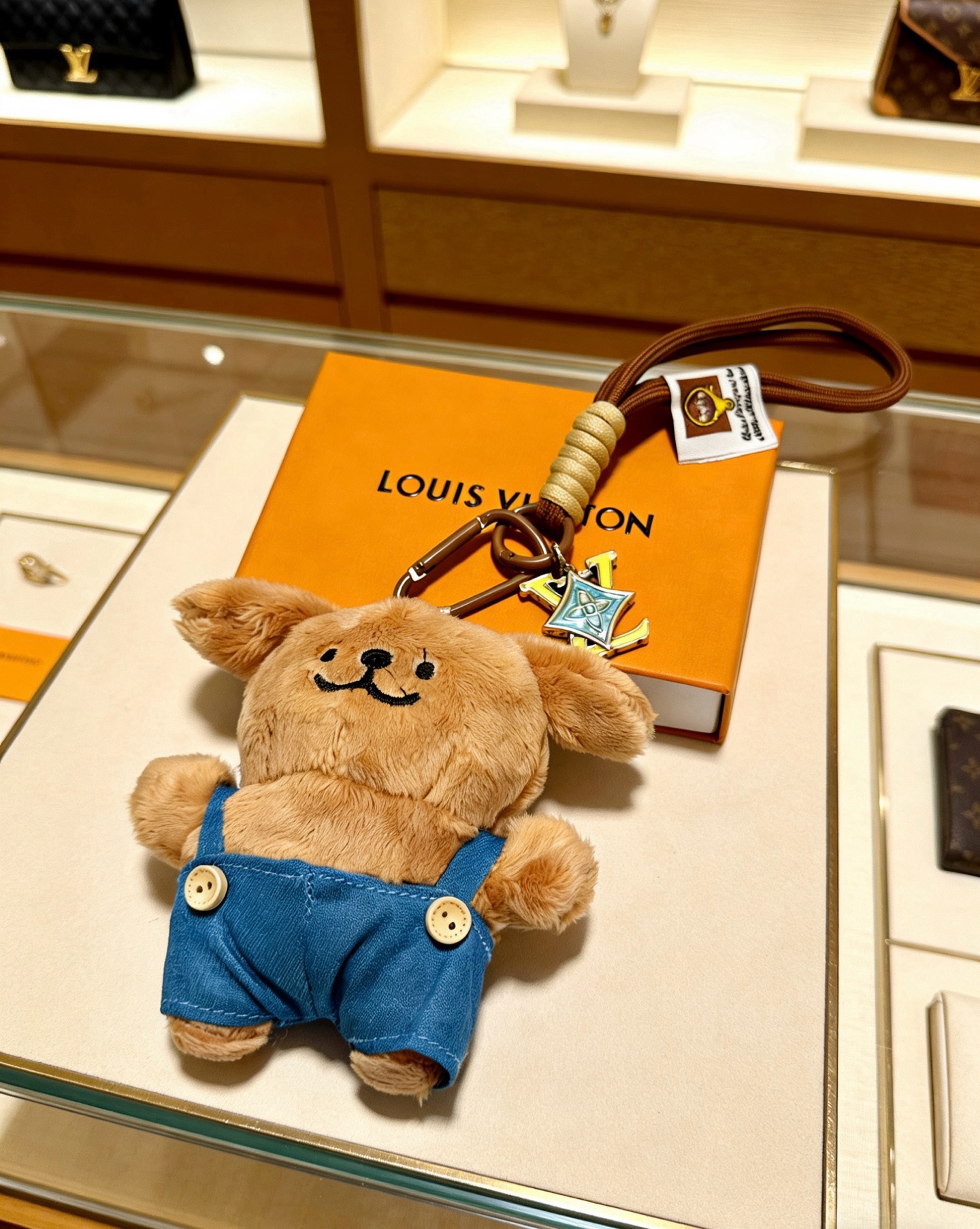 Louis Vuitton Anger Forest Plush Puppy Keychain Charm pendant Brown cord gold-tone metal hardware light blue enamel LV charm tan plush blue denim overalls 12cm total strap length