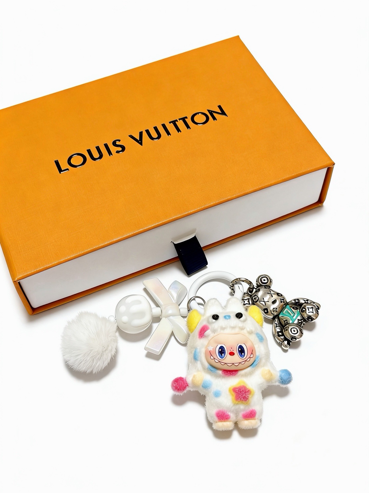 Louis Vuitton Anger Forest Custom Labubu Bear Keychain pendant Silver-tone metal with turquoise LV logo white plush with pastel pink blue yellow accents white pom-pom and bow accents 8cm total length