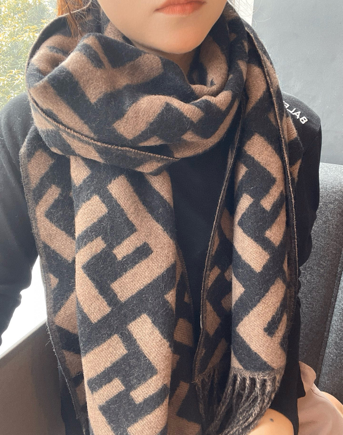 “FENDI Dominates Fashion World with Wool Scarf and Matching Dress”
