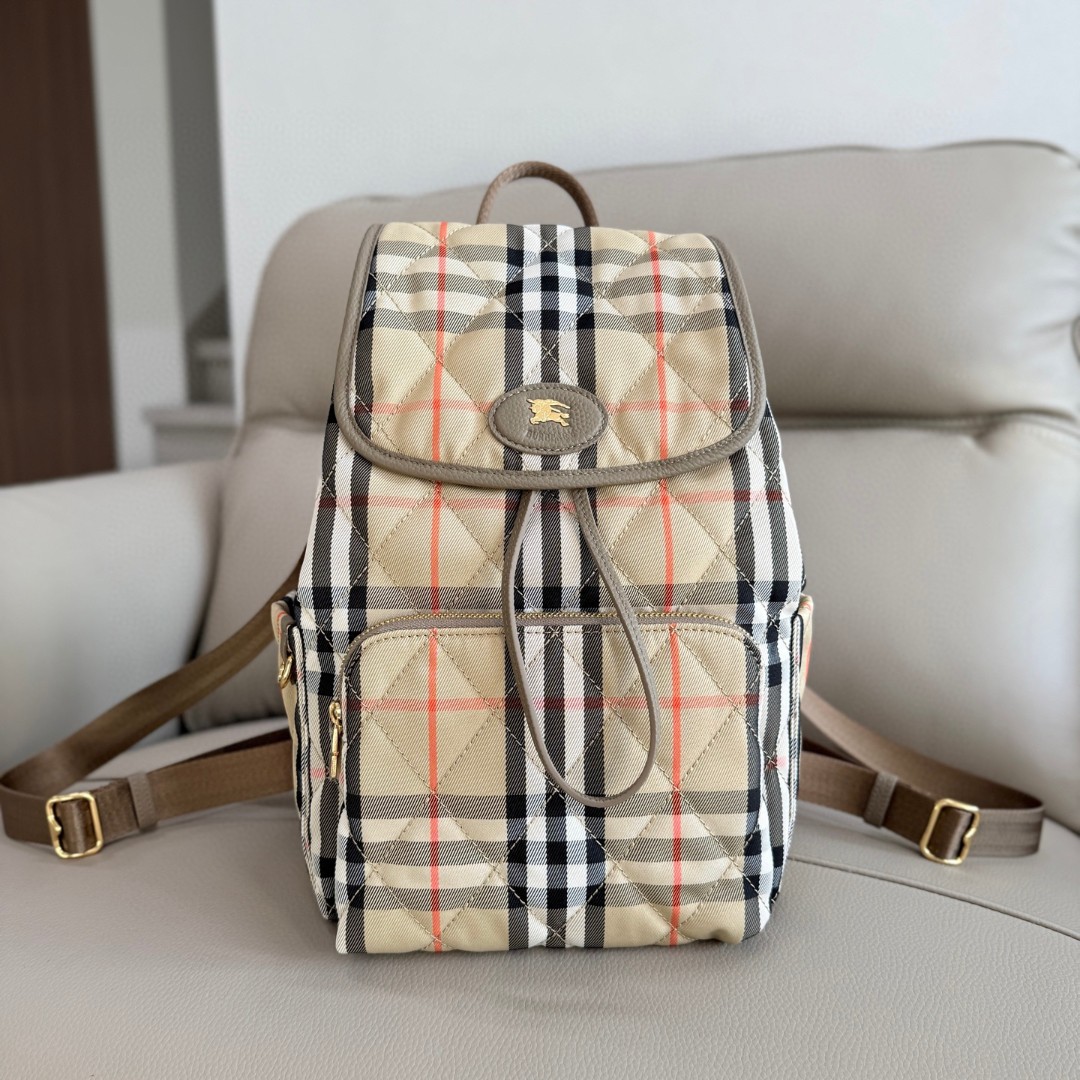 Burberry's soft and upright Horseshoe backpack draws inspiration from the elegance of the British countryside. Made of quilted nylon fabric with