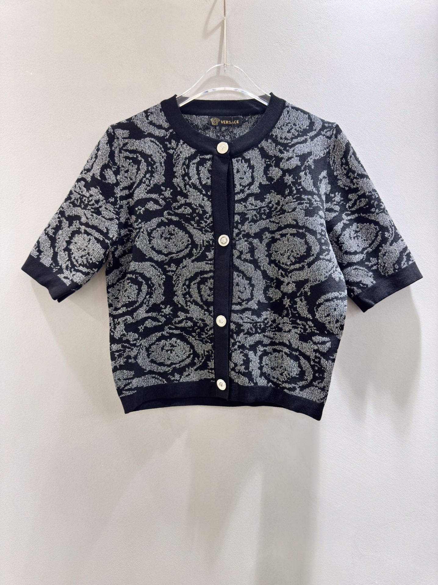Versace black short sleeve knit cardigan with color block print and shimmer.-Big cat