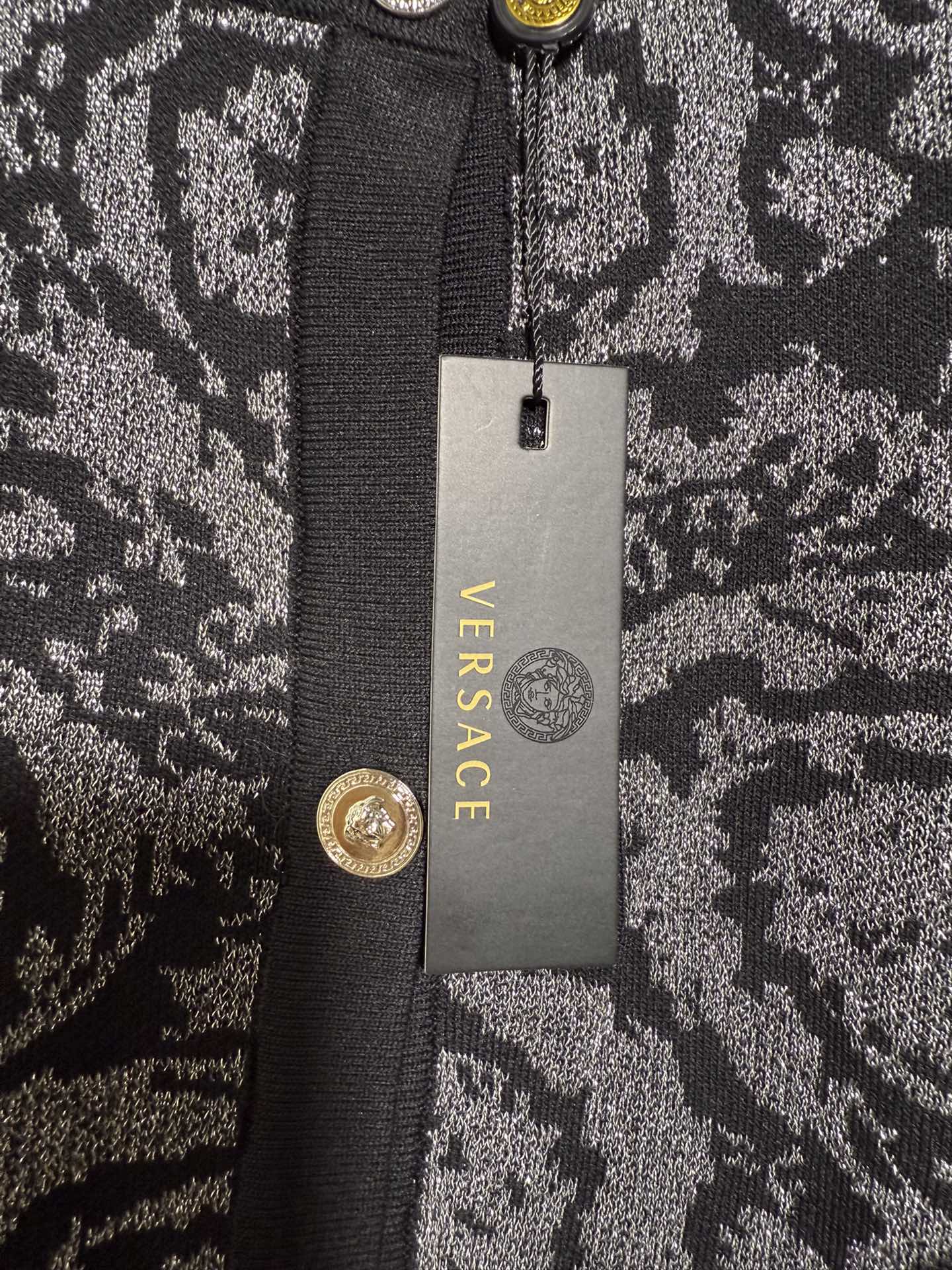 Versace black short sleeve knit cardigan with color block print and shimmer.-Big cat