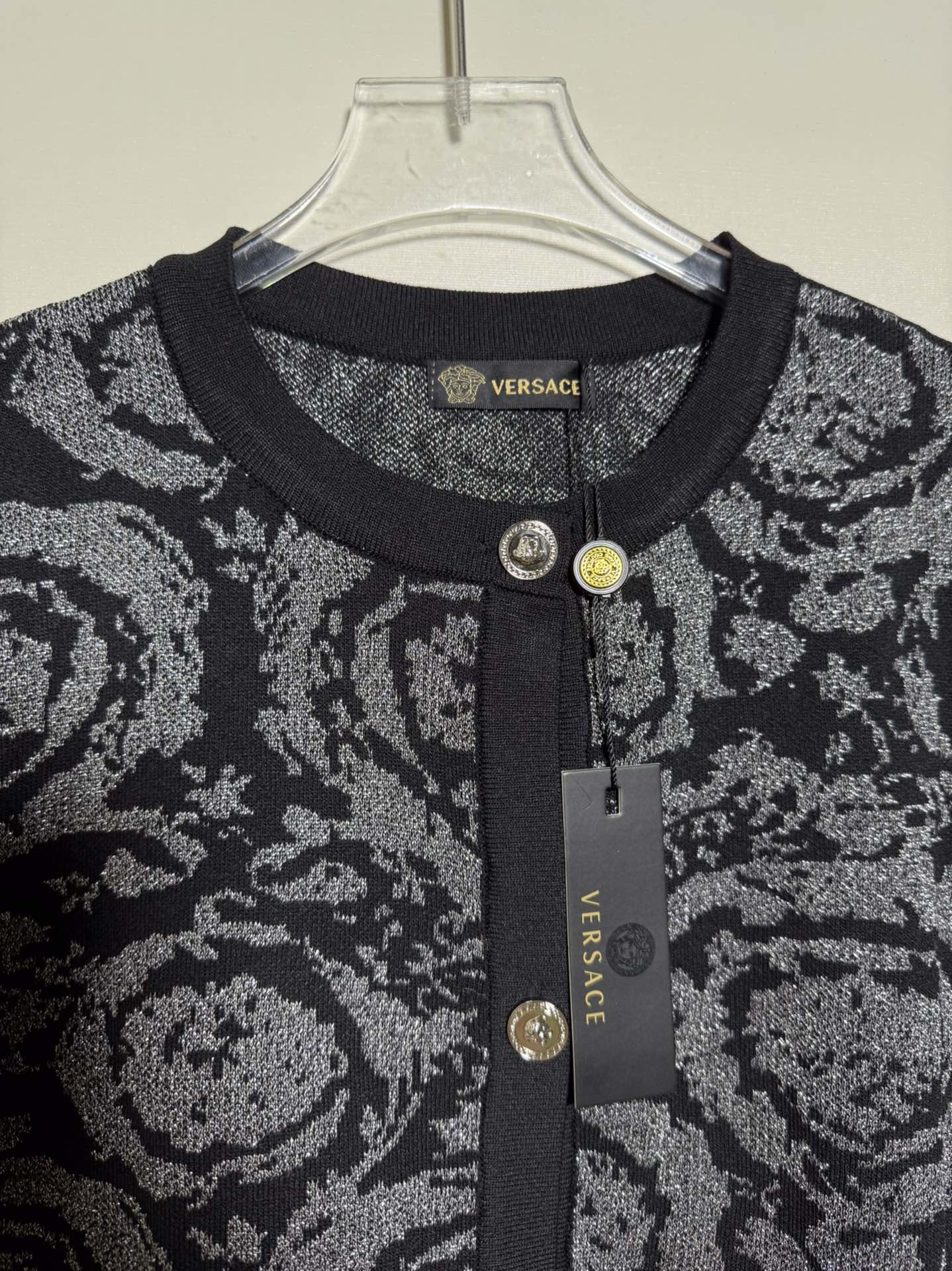 Versace black short sleeve knit cardigan with color block print and shimmer.-Big cat