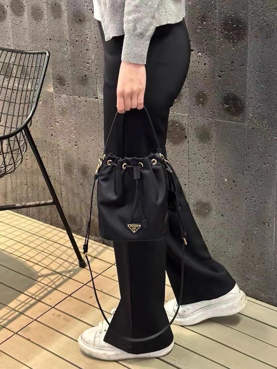Prada Product _d-9qfiXo8X9_vdnQkMwTMK80_XAecieUD-z7d_A