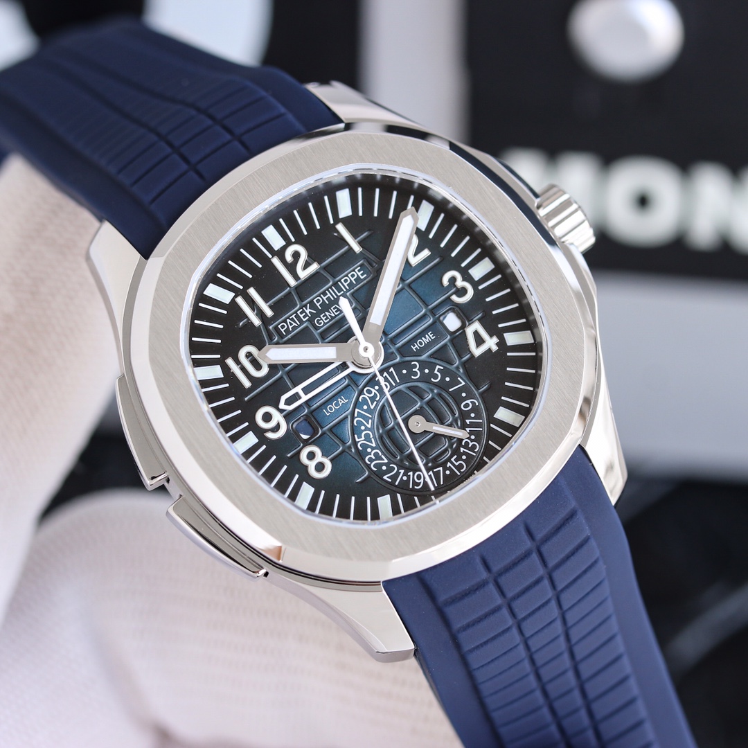 NO:386391,3K Patek Philippe Aquanaut Series 5164 Grenade Series The watch has a modern and international complexity of time, which is more in line with the taste and needs of the younger generation. [Case] ​​40.8MM diameter, 11.4MM thickness, and is still made of Patek Philippe classic stainless steel material. The rounded octagonal shell is just right. The shark fin design on the left side of the case is a button that can quickly adjust the center hollow hour hand. This hand can be used to indicate the second time zone time. [Dial] Black embossed dial, metal three-dimensional fonts, and fluorescent coated hour markers. The square day and night windows showing 'HOME' and 'LOCAL' are rotatable at 3 and 9 o'clock. The blue and white colors each represent the evening and daytime. The 6 o'clock position is a pointer-style date dial. [Movement] uses Japanese modified 324 SC  FUS automatic winding movement function, the large three-pin basic movement is equipped with two-place time modules. The casual Tropical strap is the luxurious sports watch prepared for the younger generation. Patek philippe198609093K百达翡丽 Aquanaut系列5164 手雷系列 腕表具现代感、国际感的两地时间复杂功能,更符合年轻世代的品味与需求【表壳】40.8MM表径,厚度11.4MM,依旧采用百达翡丽经典不锈钢材质打造,圆润的八角壳型恰到好处,表壳左侧的鲨鱼鳍型设计,是可以快调中央镂空时针的按钮,这枚指针可以用来指示第二时区时间.【表盘】黑色浮雕表盘,金属立体字块,覆荧光涂层时标.3、9点钟分别显示”HOME”与”LOCAL”的方形昼夜视窗可转动的,蓝白二色各自代表晚上与白天,6点钟位置是指针式的日期盘.【机芯】采用日本改324 SC FUS自动上链机芯功能,大三针基础机芯上搭载两地时间模组.配有休闲气息的Tropical表带,正是为年轻世代所准备的奢华运动表,,patek philippe,Watch