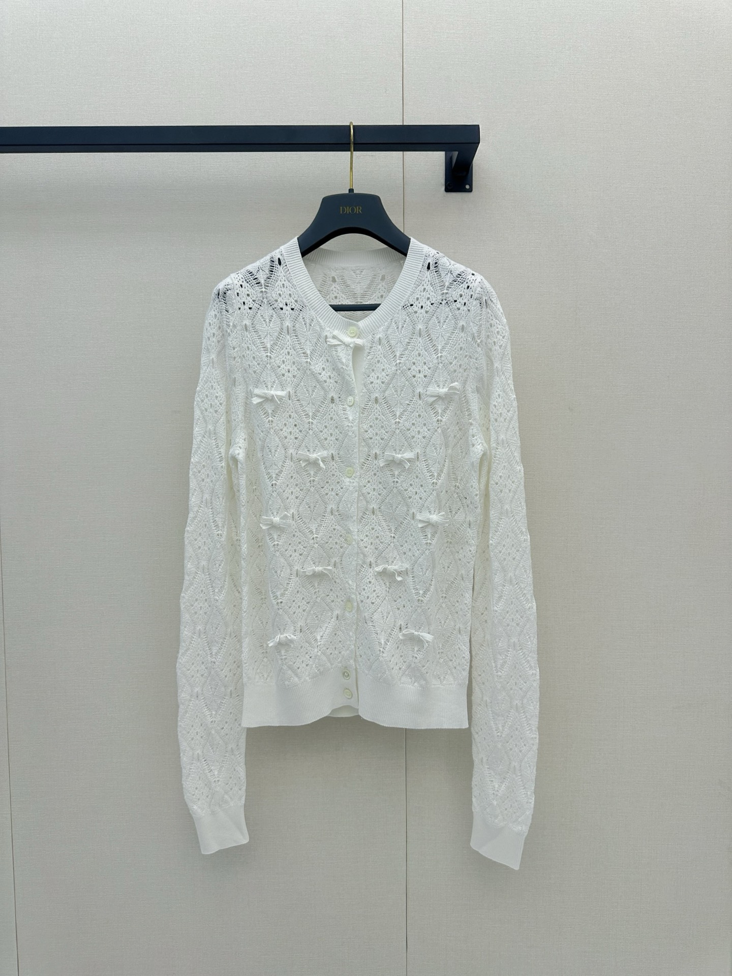 NO:879005,*26new bow-knot hollow knitted cardigan with rhombus hollow + three-dimensional bow design. The round-neck cardigan style is full of French romantic atmosphere. It is slim, light and breathable, and is super comfortable to wear in spring and summer!  Exclusively customized imported yb cotton material, all-over bow details are exquisite, and the hollowing process enhances the sense of hierarchy. It is very elegant and sweet when paired with jeans or skirts ~ It can be easily used in daily life or light formal occasions. It is one of the classic design representatives of the D family. 1:1 awesome version, the latest item for spring and summer, look for the exclusive high version. Ready in stock SML, dior, skirts, jeans,19860909*26new蝴蝶结镂空针织开衫菱格镂空+立体蝴蝶结设计,法式浪漫氛围感满满圆领开衫版型,显瘦又轻盈透气,春夏穿超舒服！独家定制进口yb棉材质,通体蝴蝶结细节精致,镂空工艺提升层次感,搭牛仔裤或半裙都很优雅甜美～日常或轻正式场合都能轻松驾驭,是D家经典设计代表之一 1:1超赞版型,春夏最新单品,认准独家高版本 现货 SML,,dior,skirts,jeans,,Women's clothing
