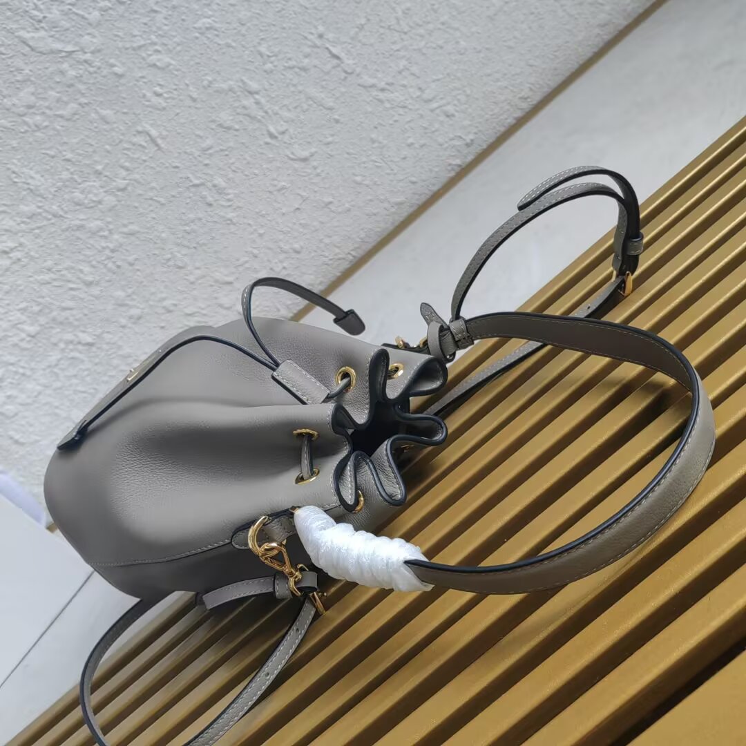 Prada Mini Bucket Bag with Adjustable Leather Strap - Stylish & Versatile 4 a1744351744624 5026