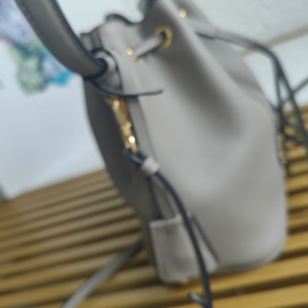 Prada Mini Bucket Bag with Adjustable Leather Strap - Stylish & Versatile 8 a1744351748725 1862