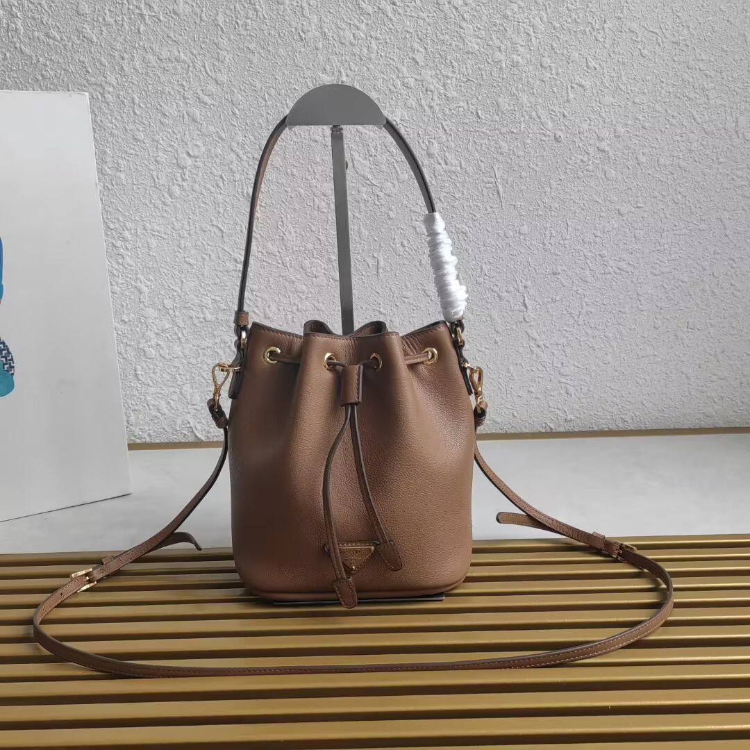 Prada Mini Bucket Bag in Leather with Adjustable Shoulder Strap 1 a1744351992903 5060
