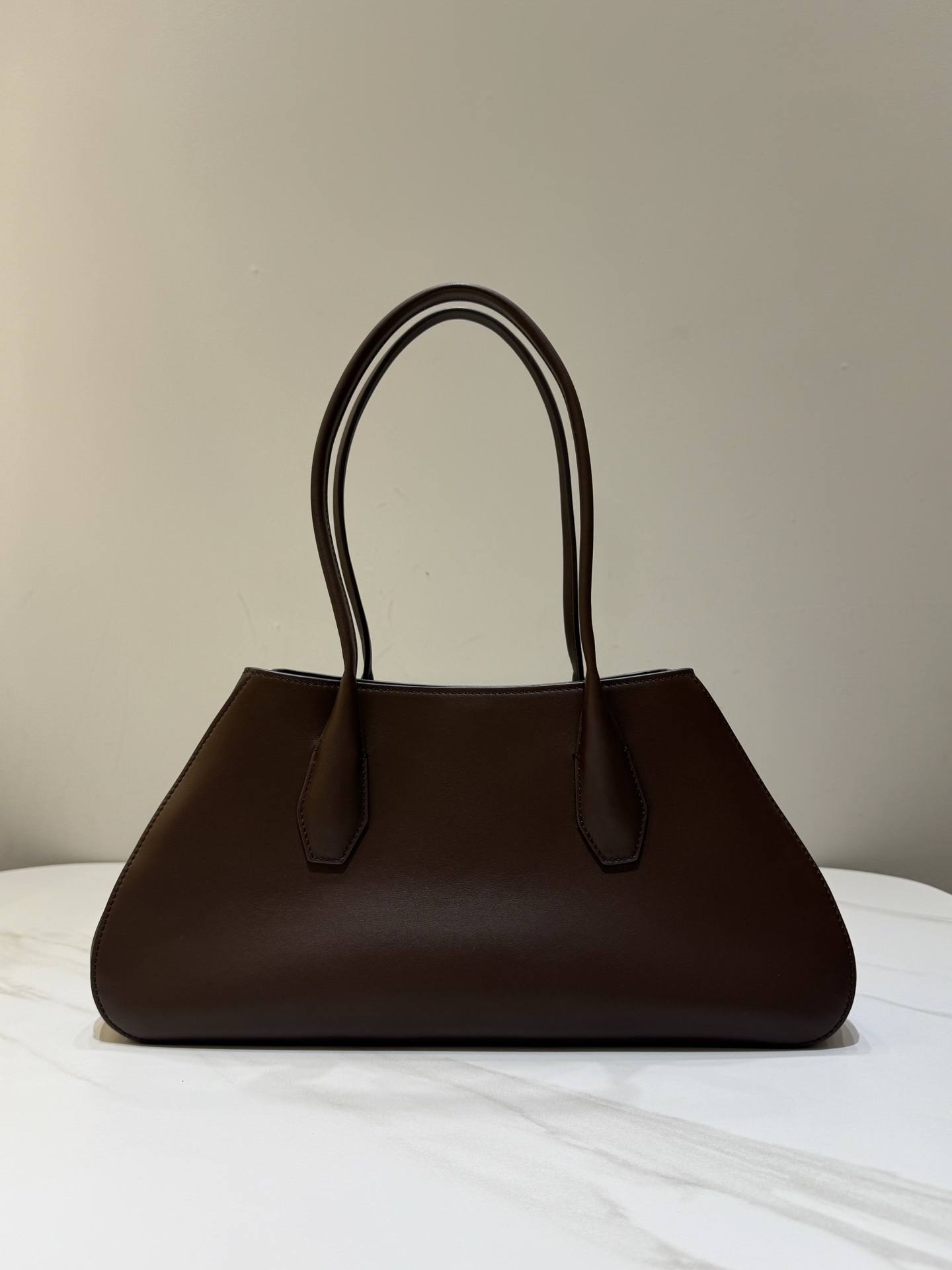 The Row Alger Saddle Leather Trapezoid Handbag