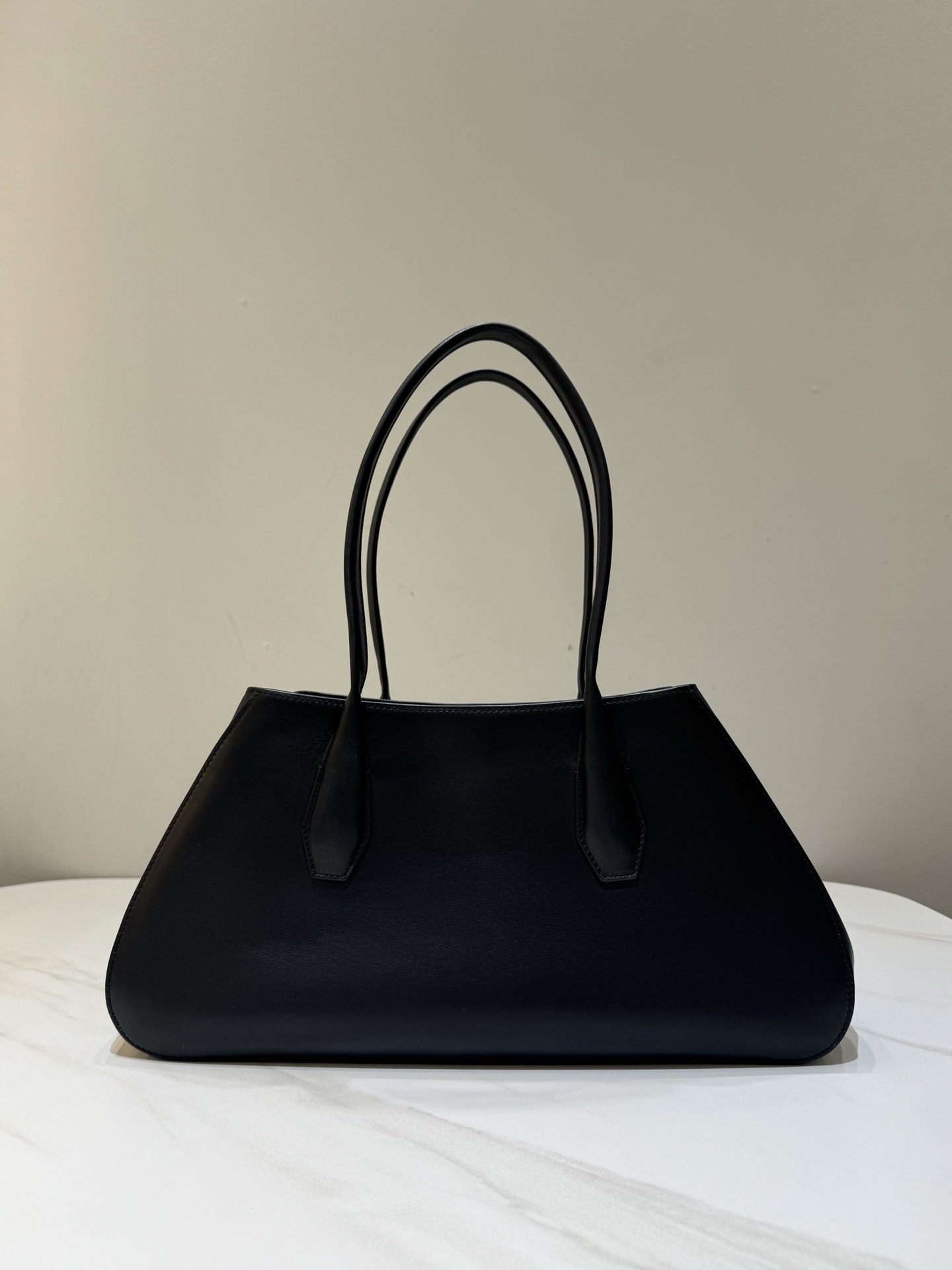 The Row Alger Black Trapezoid Saddle Leather Handbag