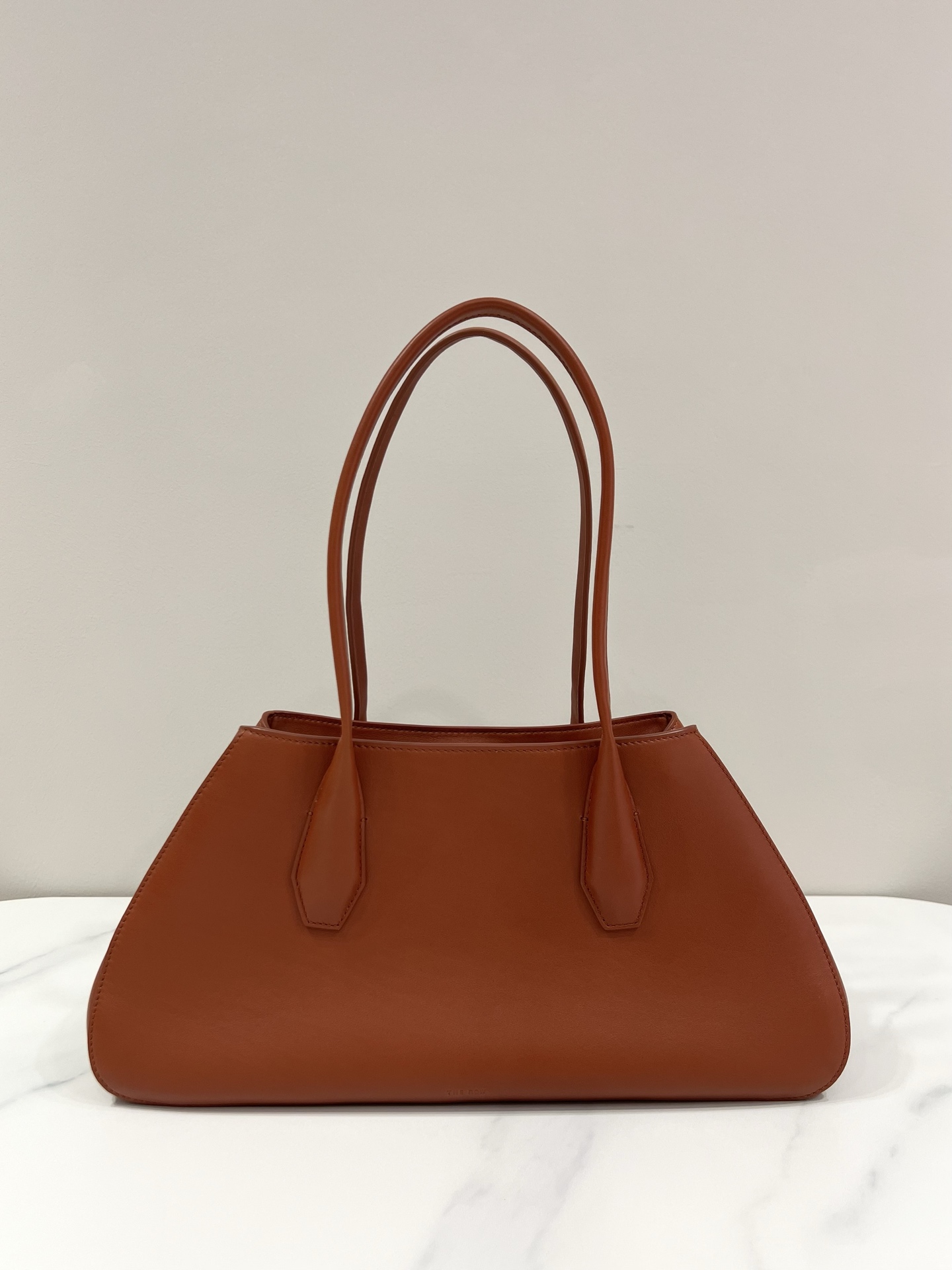 The Row Alger Reddish Brown Trapezoid Saddle Leather Handbag