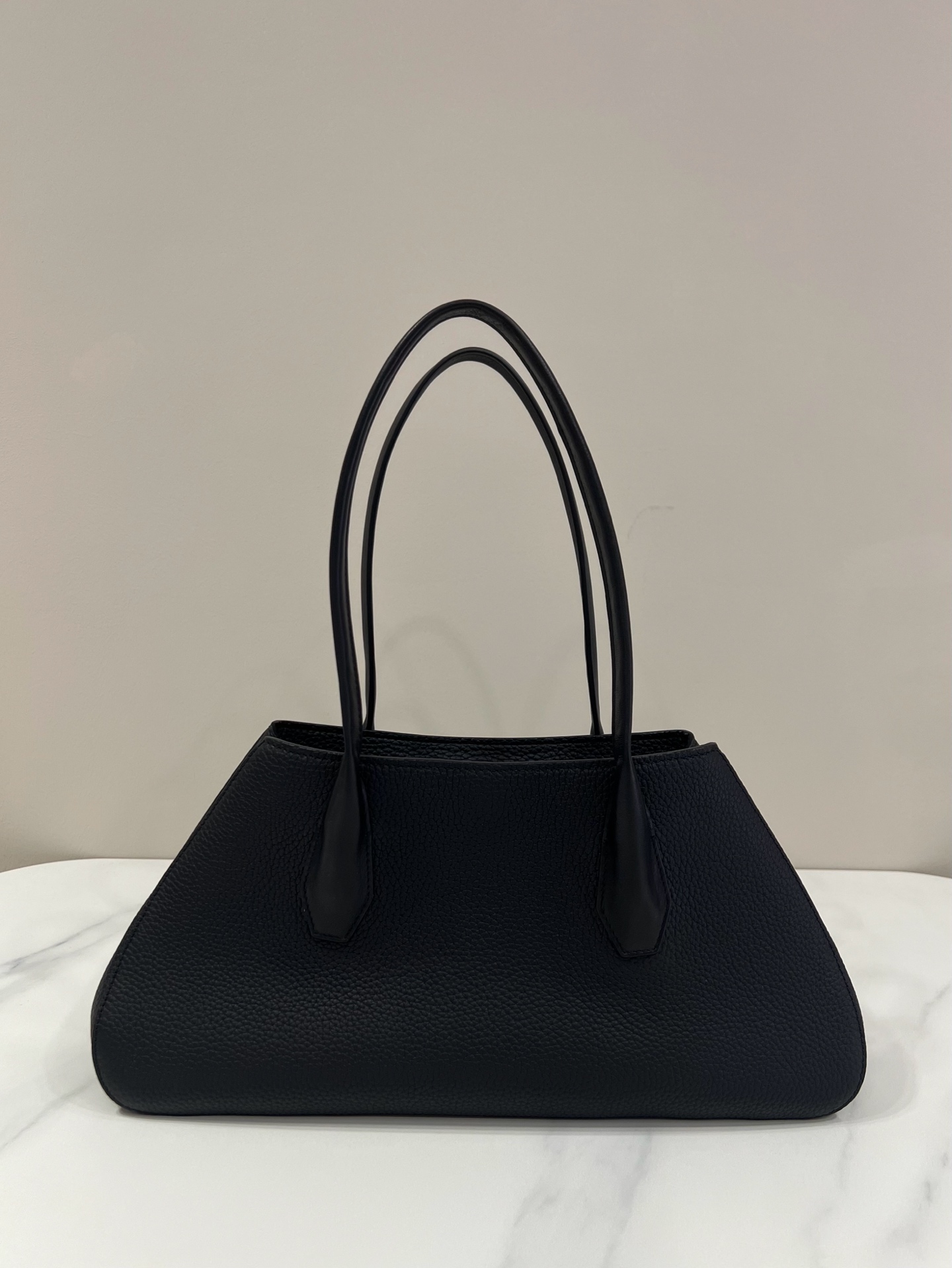 The Row Alger Black Grained Calfskin Trapeze Top Handle Bag