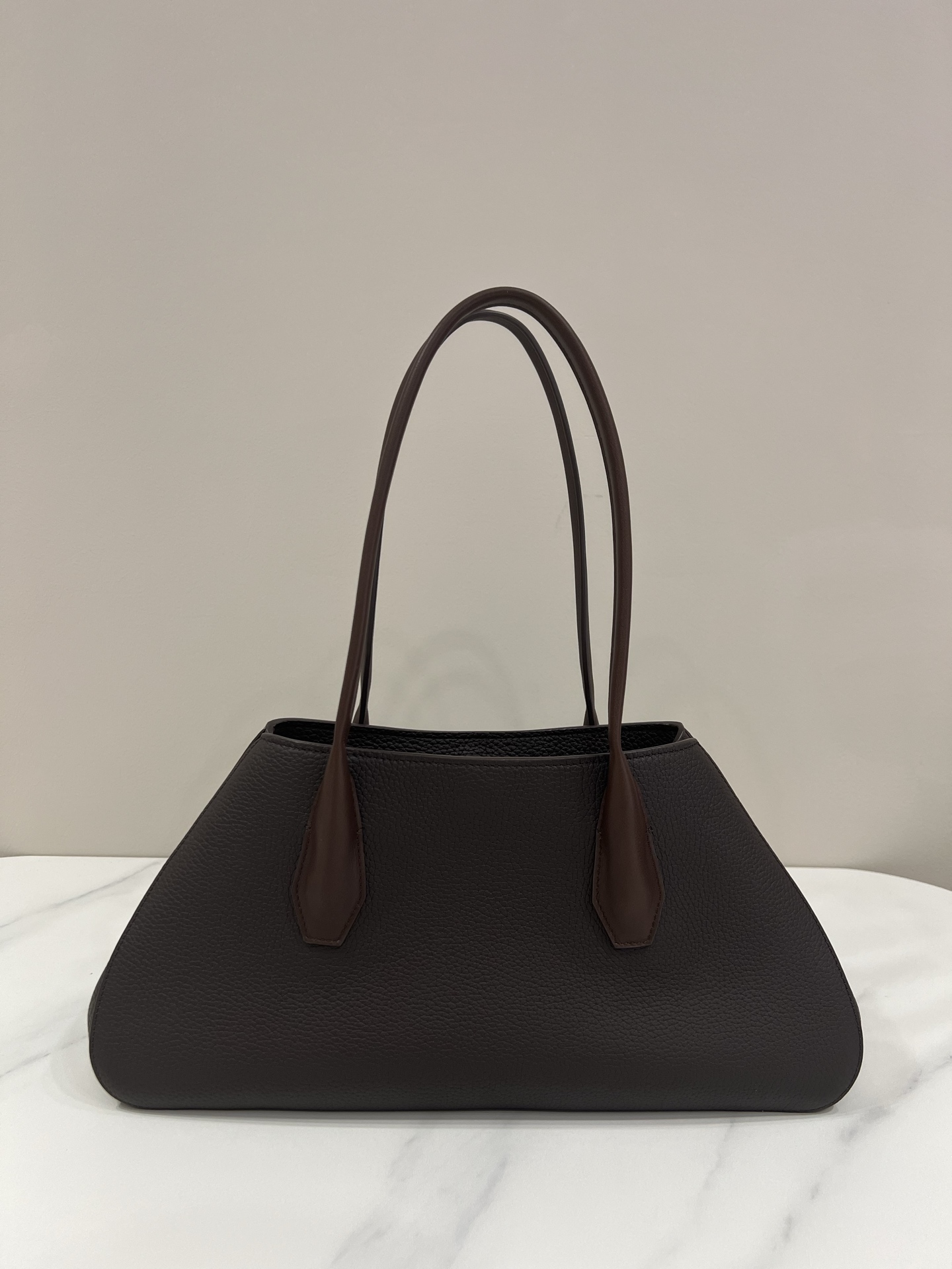 The Row Alger brown lychee-textured trapezoid handbag