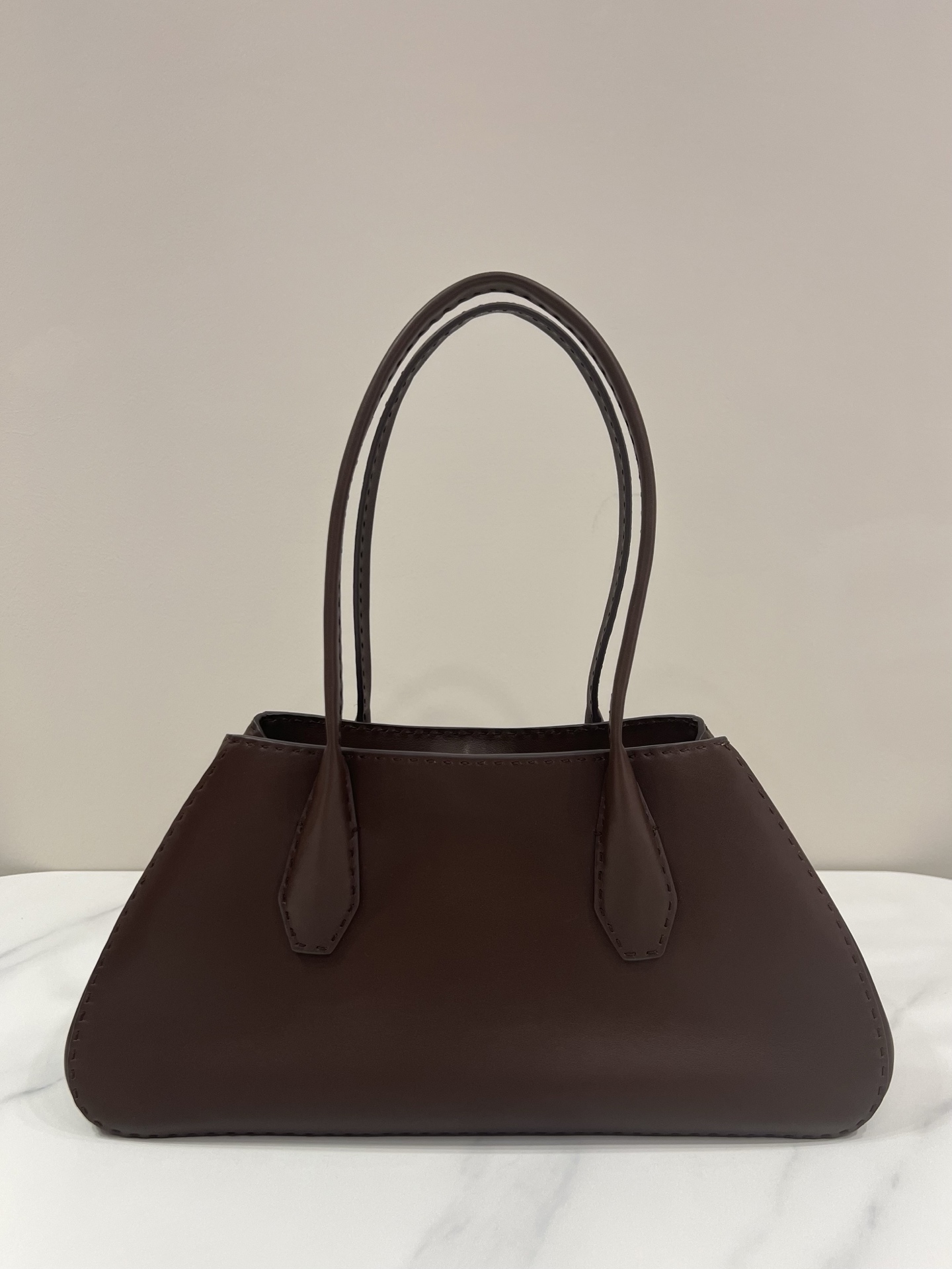 The Row Alger trapezoid lychee-texture handbag