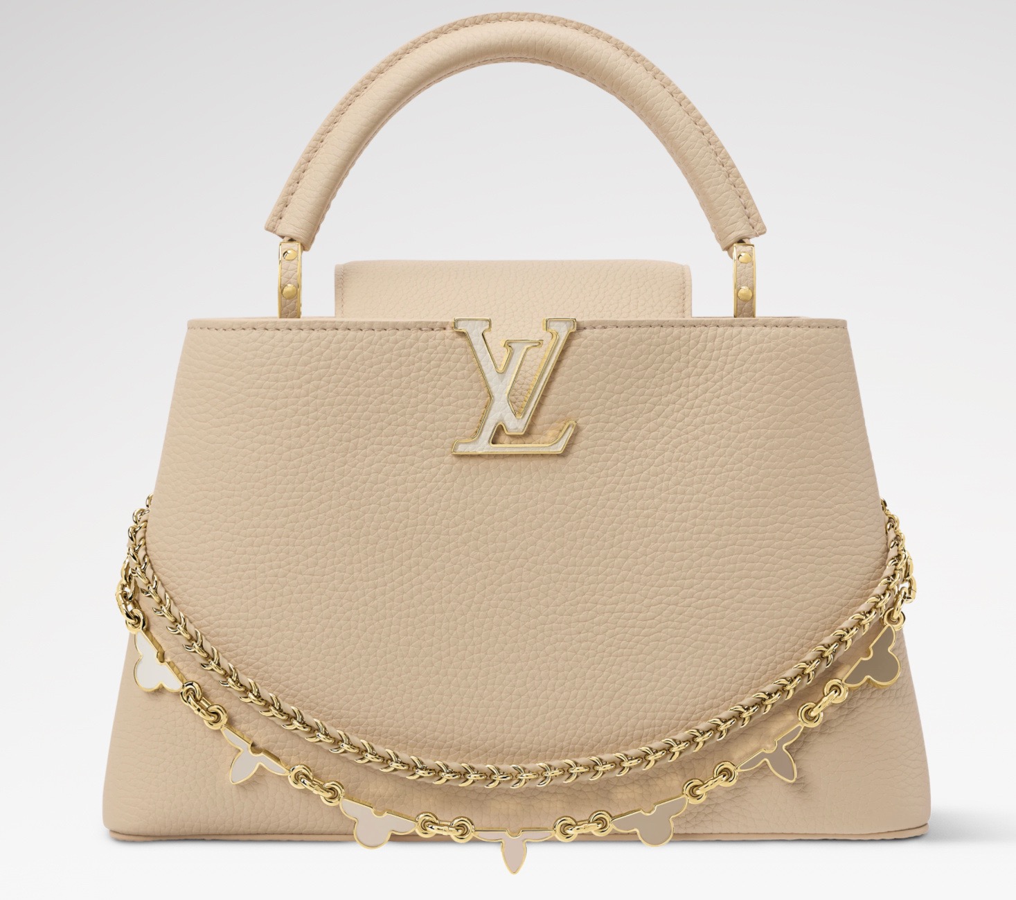 NO:938900,Top original order [CAUCINES BB handbag] M29955 apricot/enamel (macaron color) This Caucines BB handbag comes from the Flowergram series, reinterpreting Louis Vuitton's classic Flower Crown jw as decorative chain details. Each flower requires 3 hours of exquisite craftsmanship to assemble. Taurillon cow leather bag body embellished with LV  Letters and auxiliary chains, braided details sublimate the exquisite style. The double carrying configuration can accommodate daily needs, and the inner patch pocket is convenient for storing small items. Dimensions 13.6 x 21 x 8 cm.110121250 Dimensions 27 x 19 x 9 cm.120121350 (length x height x width),,louis vuitton,louis vuitton,cowhide19860909顶级原单【CAUCINES BB 手袋】M29955 杏色/珐琅（马卡龙配色） 本款 Caucines BB 手袋出自 Flowergram 系列,将路易威登经典 Flower Crown jw重新演绎为装饰链条细节,每朵花卉均需 3 小时精湛匠艺组装而成.Taurillon 牛皮革袋身点缀 LV 字母与辅助链条,编织细节升华工致格调.双重背携构型可容纳日常所需,内贴袋便于收纳小件物品. 尺寸13.6 x 21 x 8 厘米.110121250 尺寸27 x 19 x 9 厘米.120121350 (长度 x 高 x 宽),,louis vuitton,louis vuitton,cowhide,Bag
