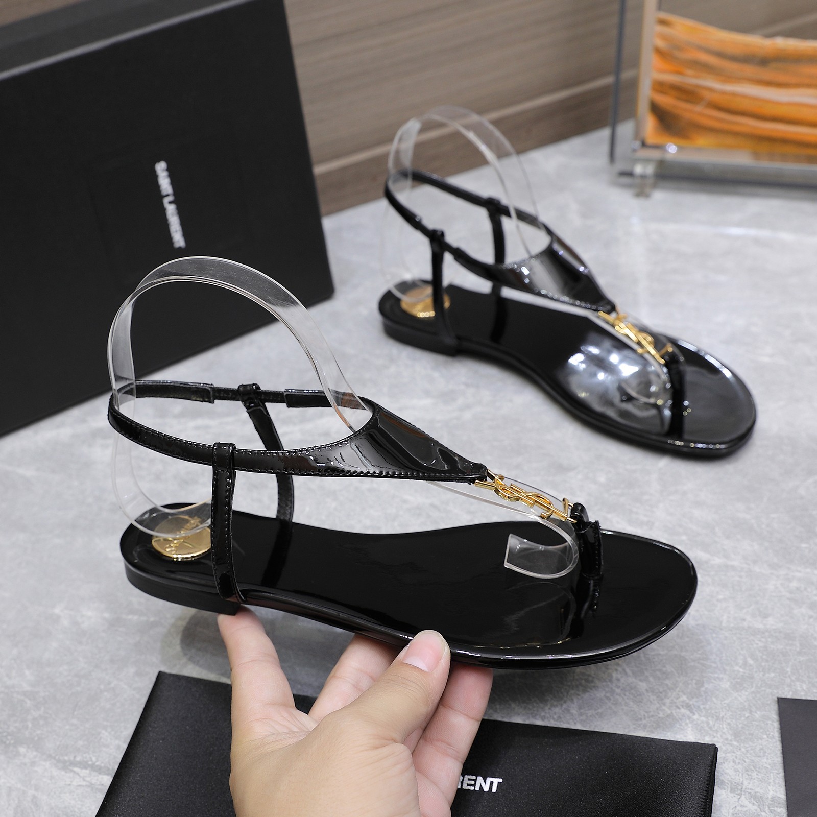 Saint Laurent Women's Cassandre Thong Sandals in Patent Leather Black 2 a1745067394322 4681