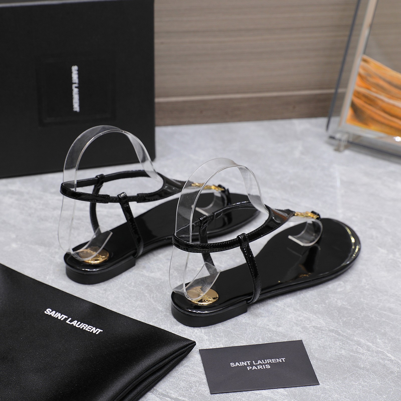 Saint Laurent Women's Cassandre Thong Sandals in Patent Leather Black 5 a1745067394345 0706
