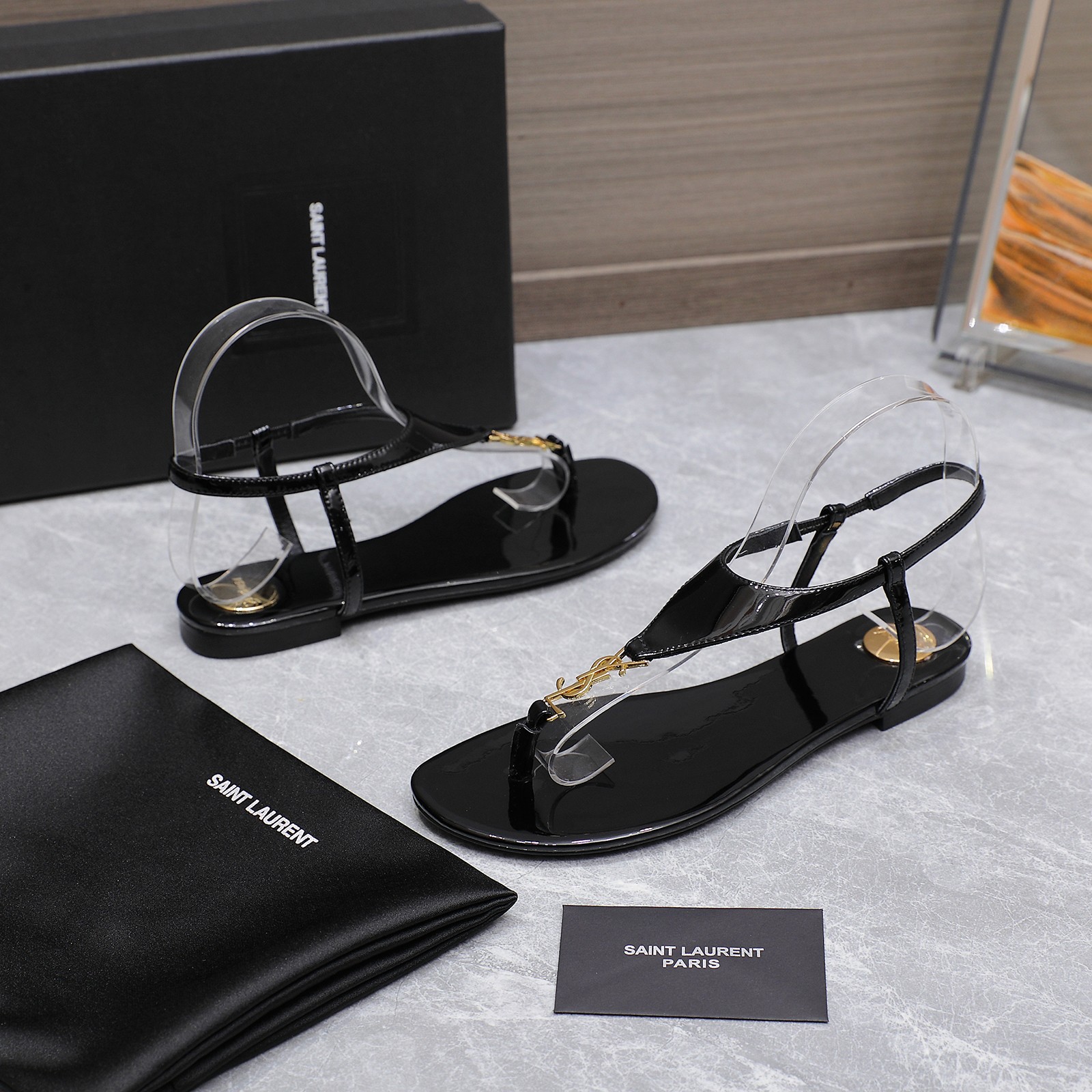 Saint Laurent Women's Cassandre Thong Sandals in Patent Leather Black 3 a1745067394414 6136