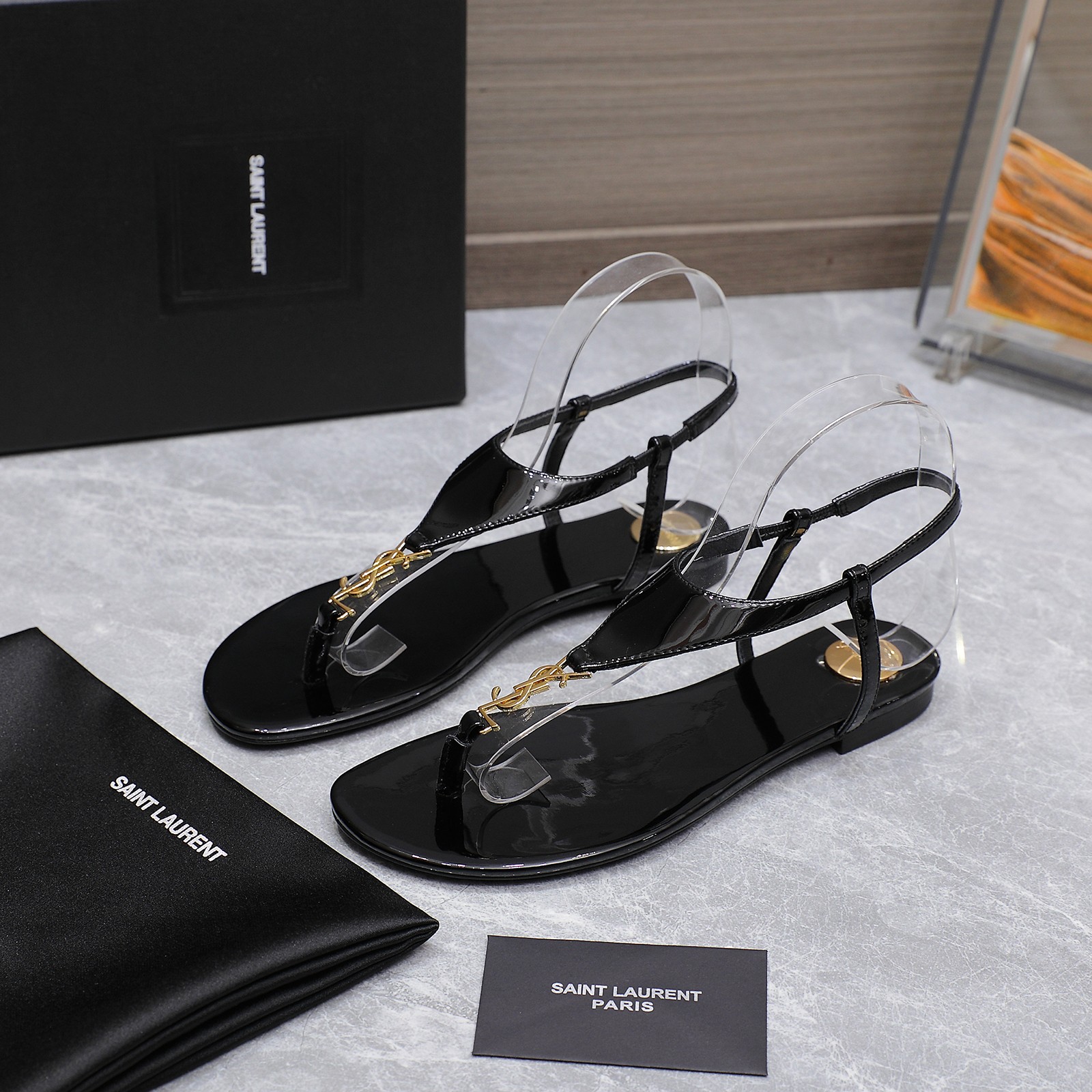 Saint Laurent Women's Cassandre Thong Sandals in Patent Leather Black 9 a1745067395434 0523
