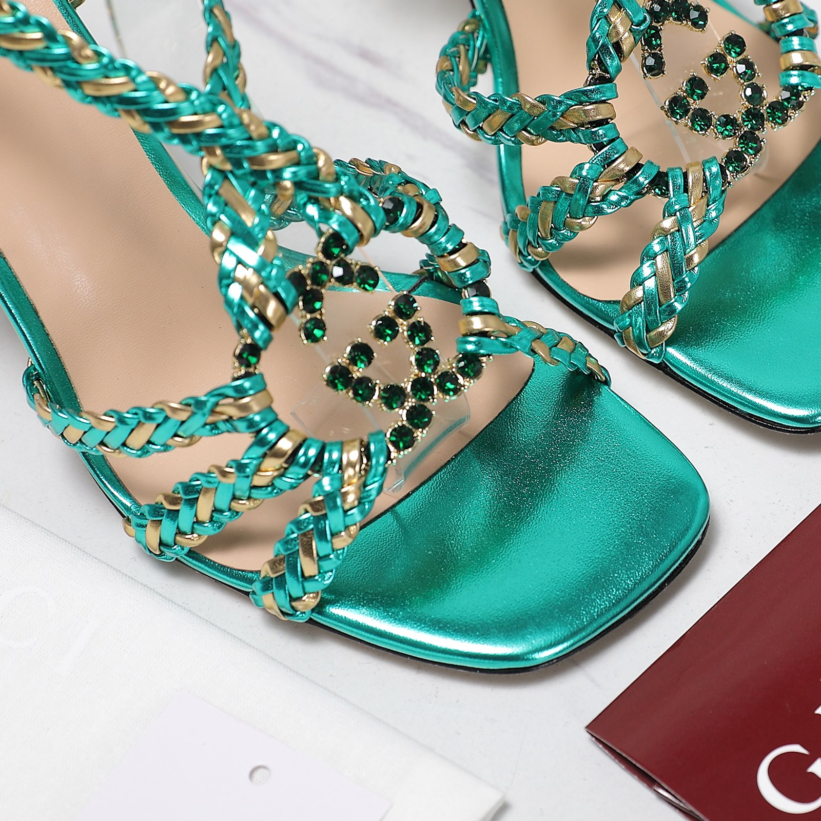 Gucci Crystal-Embellished Braided Heeled Sandals in Metallic Green 9 a1746360959766 5055