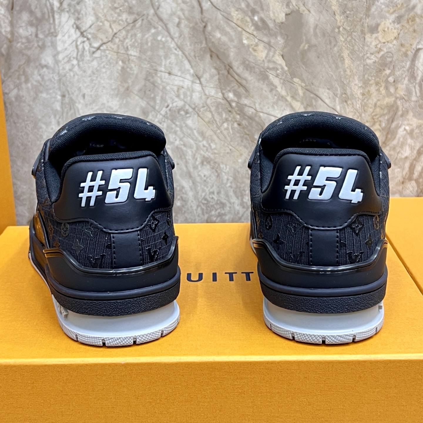Louis Vuitton Trainer Sneakers: Black Leather, Monogram Detail, and Comfort 9 i1745214974887 5534 0 7