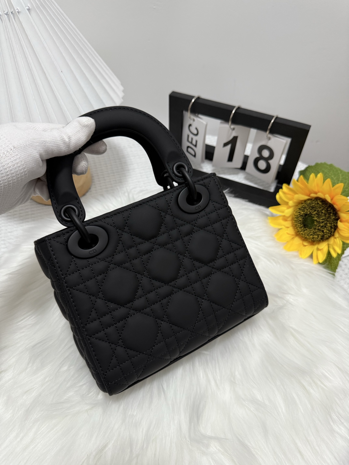 Elegant Black Lady Dior Mini Bag with Iconic Cannage Stitching and D.I.O.R. Charms 3 i1747586621603 166 0 2