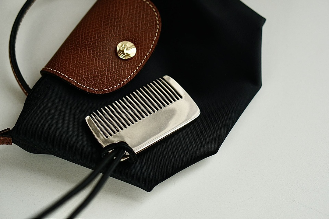 this versatile comb functions seamlessly as an elegant handbag charm - Comprehensive 3