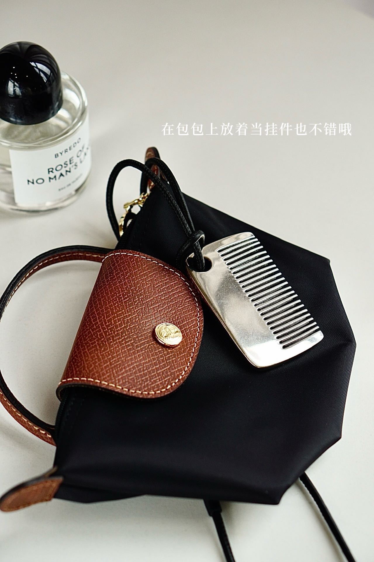 this versatile comb functions seamlessly as an elegant handbag charm - Comprehensive 2
