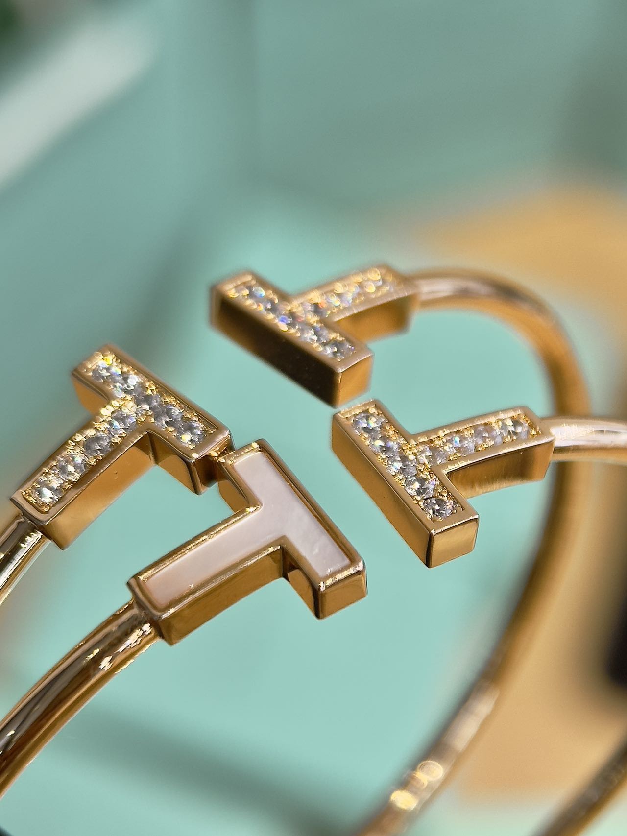This bracelet is defined by its prominent "T" motif - Comprehensive 2