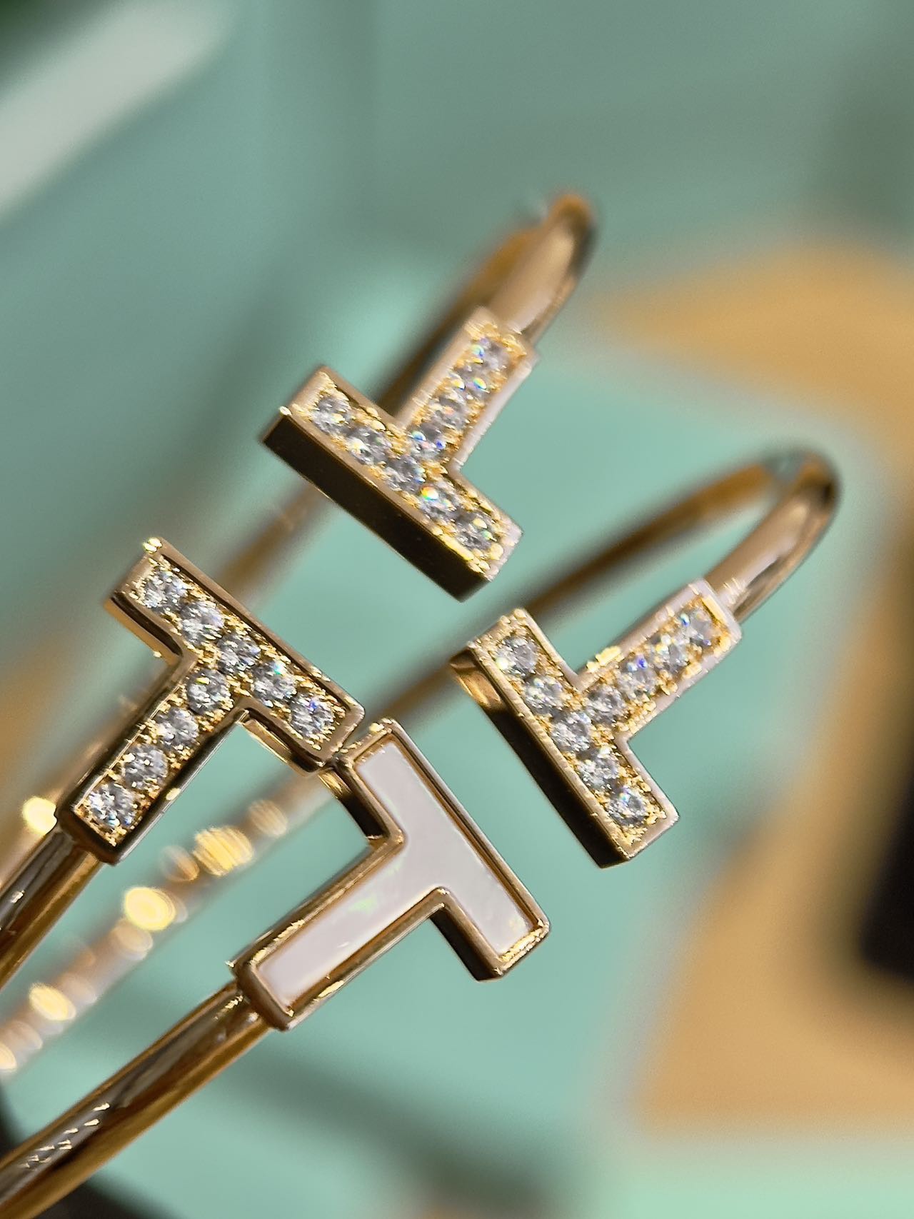 This bracelet is defined by its prominent "T" motif - Comprehensive 3